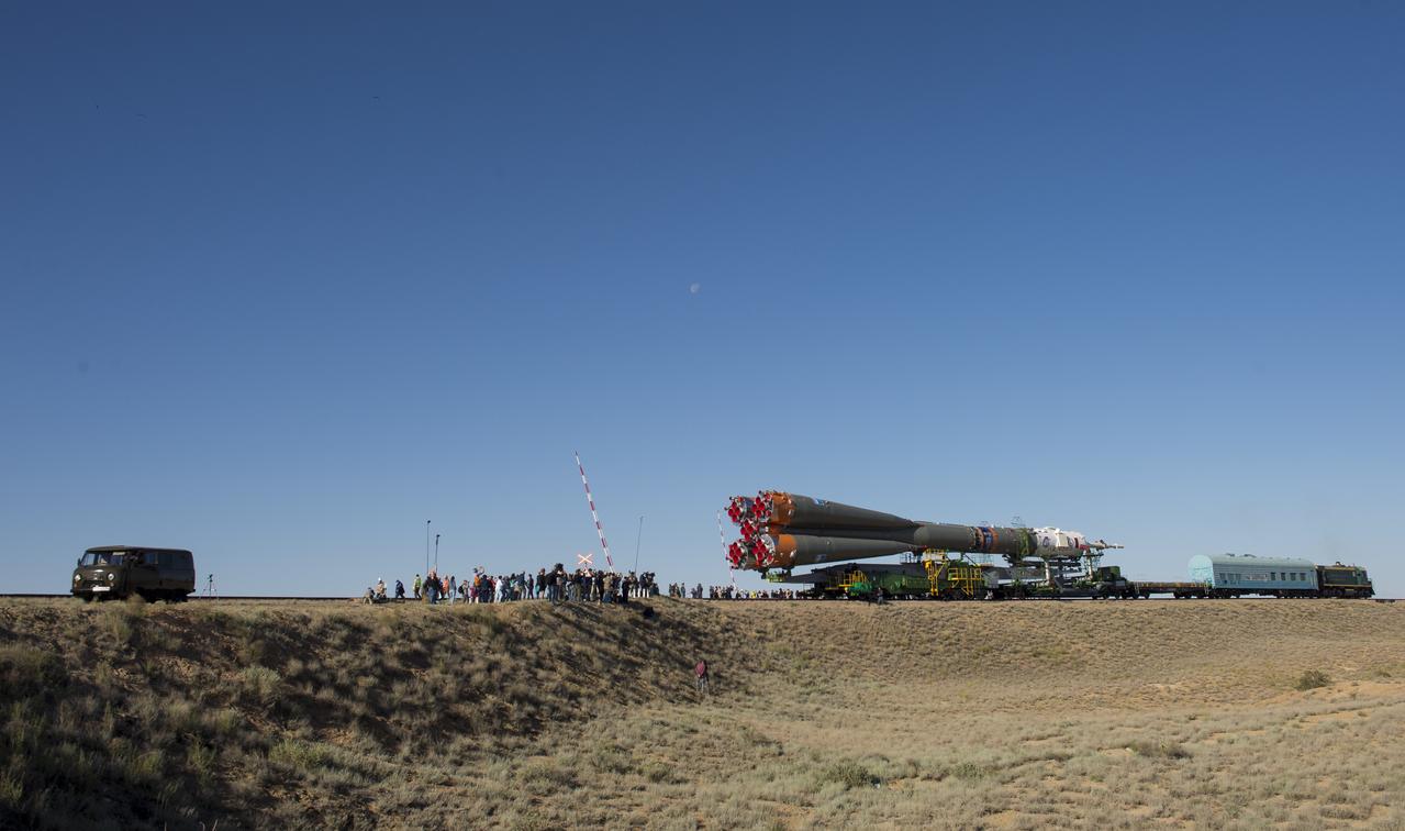 Launch guests and members of the media watch as the Soyuz rocket is rolled out by train to the launch pad, Monday, June 4, 2018 at the Baikonur Cosmodrome in Kazakhstan. Expedition 56 Soyuz Commander Sergey Prokopyev of Roscosmos, flight engineer Serena Auñón-Chancellor of NASA, and flight engineer Alexander Gerst of ESA (European Space Agency) are scheduled to launch aboard their Soyuz MS-09 spacecraft at 7:12 a.m. Eastern time (5:12 p.m. Baikonur time), on Wednesday, June 6. Photo Credit: (NASA/Joel Kowsky)