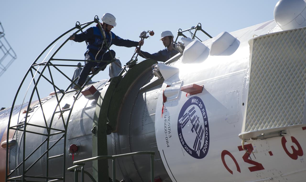 Workers prepare to raise the Soyuz rocket into a vertical position on the launch pad, Monday, June 4, 2018 at the Baikonur Cosmodrome in Kazakhstan. Expedition 56 Soyuz Commander Sergey Prokopyev of Roscosmos, flight engineer Serena Auñón-Chancellor of NASA, and flight engineer Alexander Gerst of ESA (European Space Agency) are scheduled to launch aboard their Soyuz MS-09 spacecraft at 7:12 a.m. Eastern time (5:12 p.m. Baikonur time), on Wednesday, June 6. Photo Credit: (NASA/Joel Kowsky)