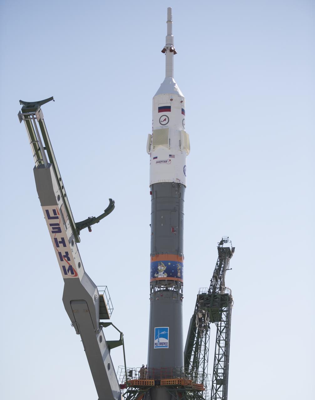 The Soyuz rocket is seen after being raised into a vertical position on the launch pad, Monday, June 4, 2018 at the Baikonur Cosmodrome in Kazakhstan. Expedition 56 Soyuz Commander Sergey Prokopyev of Roscosmos, flight engineer Serena Auñón-Chancellor of NASA, and flight engineer Alexander Gerst of ESA (European Space Agency) are scheduled to launch aboard their Soyuz MS-09 spacecraft at 7:12 a.m. Eastern time (5:12 p.m. Baikonur time), on Wednesday, June 6. Photo Credit: (NASA/Joel Kowsky)