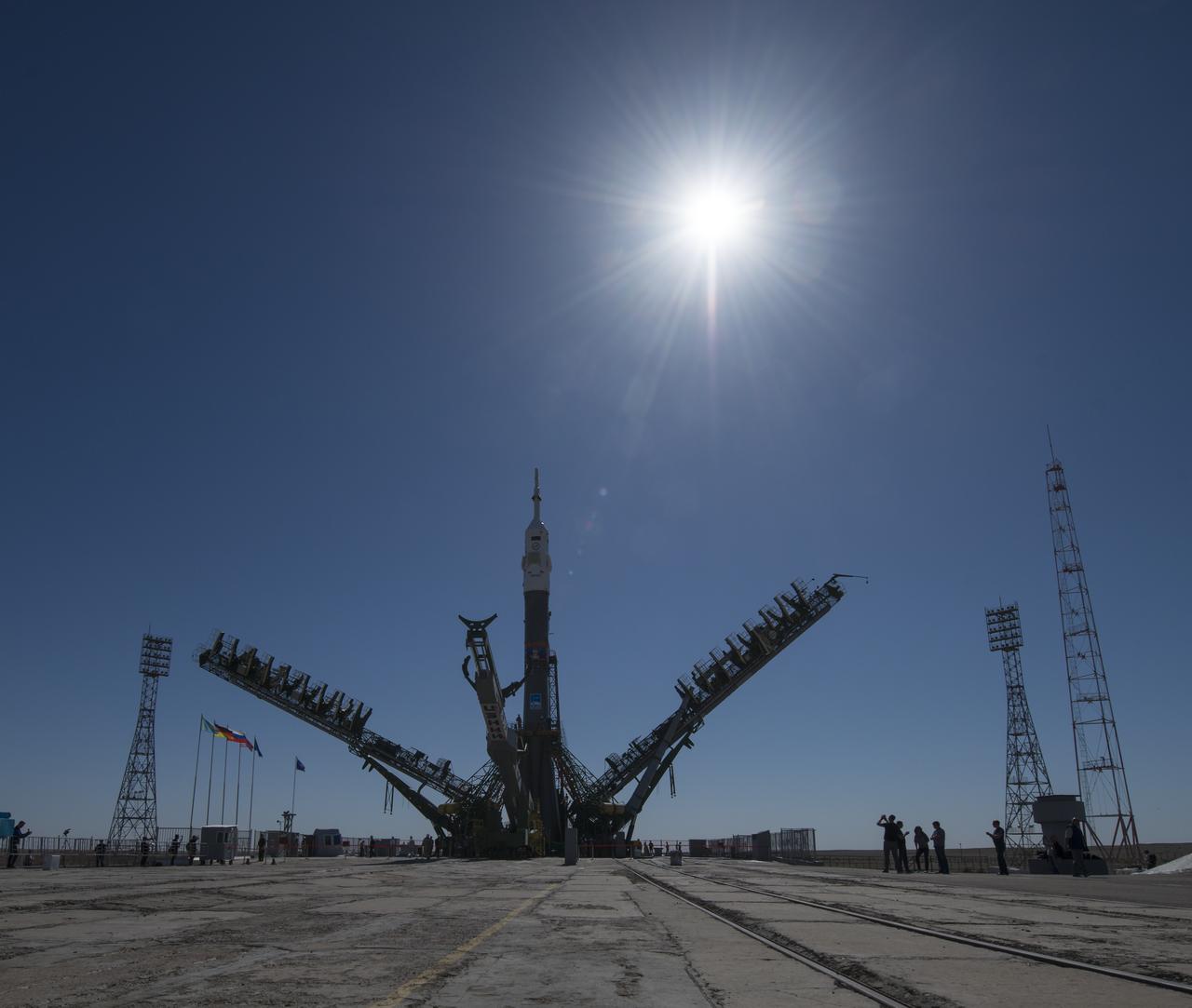 The Soyuz rocket is seen on the launch pad as the service structure arms are closed around it, Monday, June 4, 2018 at the Baikonur Cosmodrome in Kazakhstan. Expedition 56 Soyuz Commander Sergey Prokopyev of Roscosmos, flight engineer Serena Auñón-Chancellor of NASA, and flight engineer Alexander Gerst of ESA (European Space Agency) are scheduled to launch aboard their Soyuz MS-09 spacecraft at 7:12 a.m. Eastern time (5:12 p.m. Baikonur time), on Wednesday, June 6. Photo Credit: (NASA/Joel Kowsky)