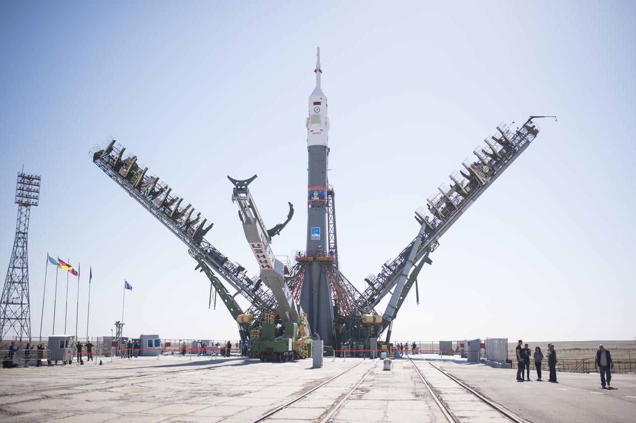 The Soyuz rocket is seen on the launch pad as the service structure arms are closed around it, Monday, June 4, 2018 at the Baikonur Cosmodrome in Kazakhstan. Expedition 56 Soyuz Commander Sergey Prokopyev of Roscosmos, flight engineer Serena Auñón-Chancellor of NASA, and flight engineer Alexander Gerst of ESA (European Space Agency) are scheduled to launch aboard their Soyuz MS-09 spacecraft at 7:12 a.m. Eastern time (5:12 p.m. Baikonur time), on Wednesday, June 6. Photo Credit: (NASA/Joel Kowsky)