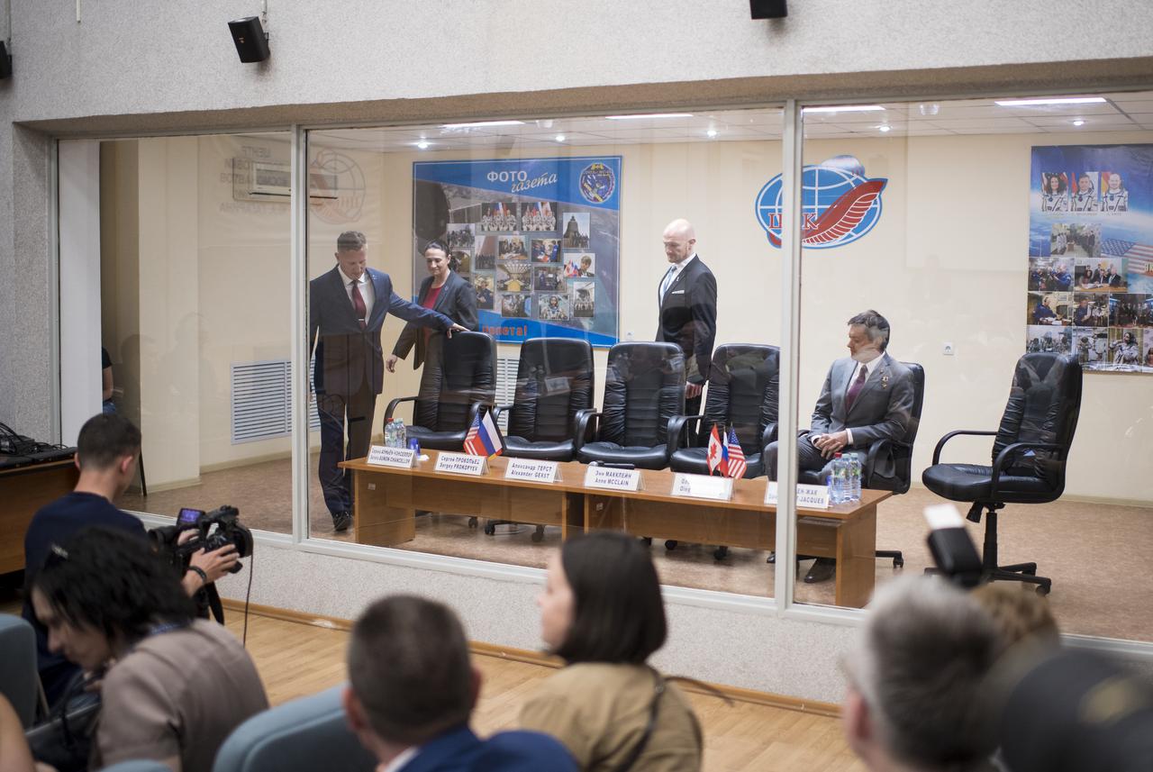 Expedition 56 Soyuz Commander Sergey Prokopyev of Roscosmos, left, flight engineer Serena Auñón-Chancellor of NASA, second from left, and backup crew member Oleg Kononenko of Roscosmos are seen as they enter prior to the State Commission meeting to approve the Soyuz launch of Expedition 56 to the International Space Station, Tuesday, June 5, 2018 at the Cosmonaut Hotel in Baikonur, Kazakhstan. Expedition 56 Soyuz Commander Sergey Prokopyev of Roscosmos, Serena Auñón-Chancellor of NASA, and Alexander Gerst of ESA (European Space Agency) are scheduled to launch to the International Space Station aboard the Soyuz MS-09 spacecraft on Wednesday, June 6. Photo Credit: (NASA/Joel Kowsky)
