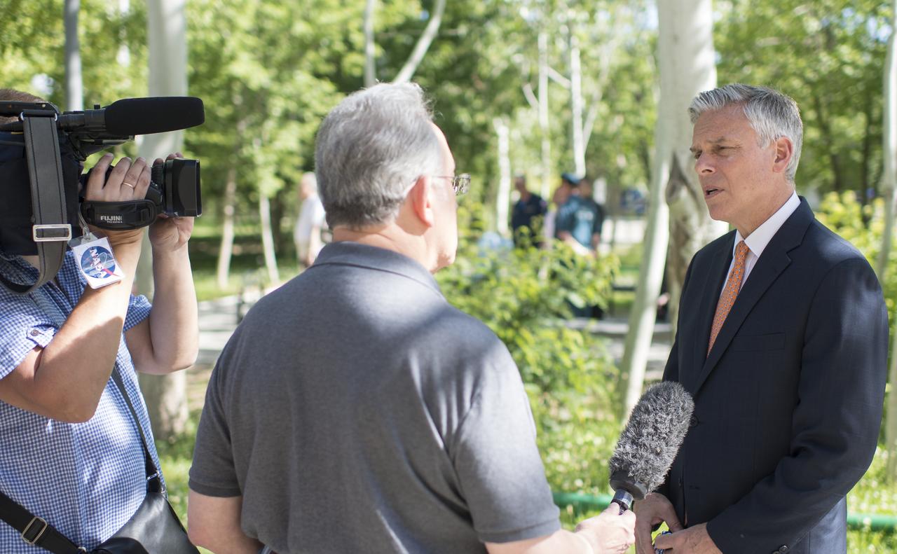 U.S. Ambassador to Russia Jon Huntsman Jr. is interviewed by NASA Public Affairs Officer Rob Navias after the completion of the State Commission meeting to approve the Soyuz launch of Expedition 56 to the International Space Station, Tuesday, June 5, 2018 at the Cosmonaut Hotel in Baikonur, Kazakhstan. Expedition 56 Soyuz Commander Sergey Prokopyev of Roscosmos, Serena Auñón-Chancellor of NASA, and Alexander Gerst of ESA (European Space Agency) are scheduled to launch to the International Space Station aboard the Soyuz MS-09 spacecraft on Wednesday, June 6. Photo Credit: (NASA/Joel Kowsky)