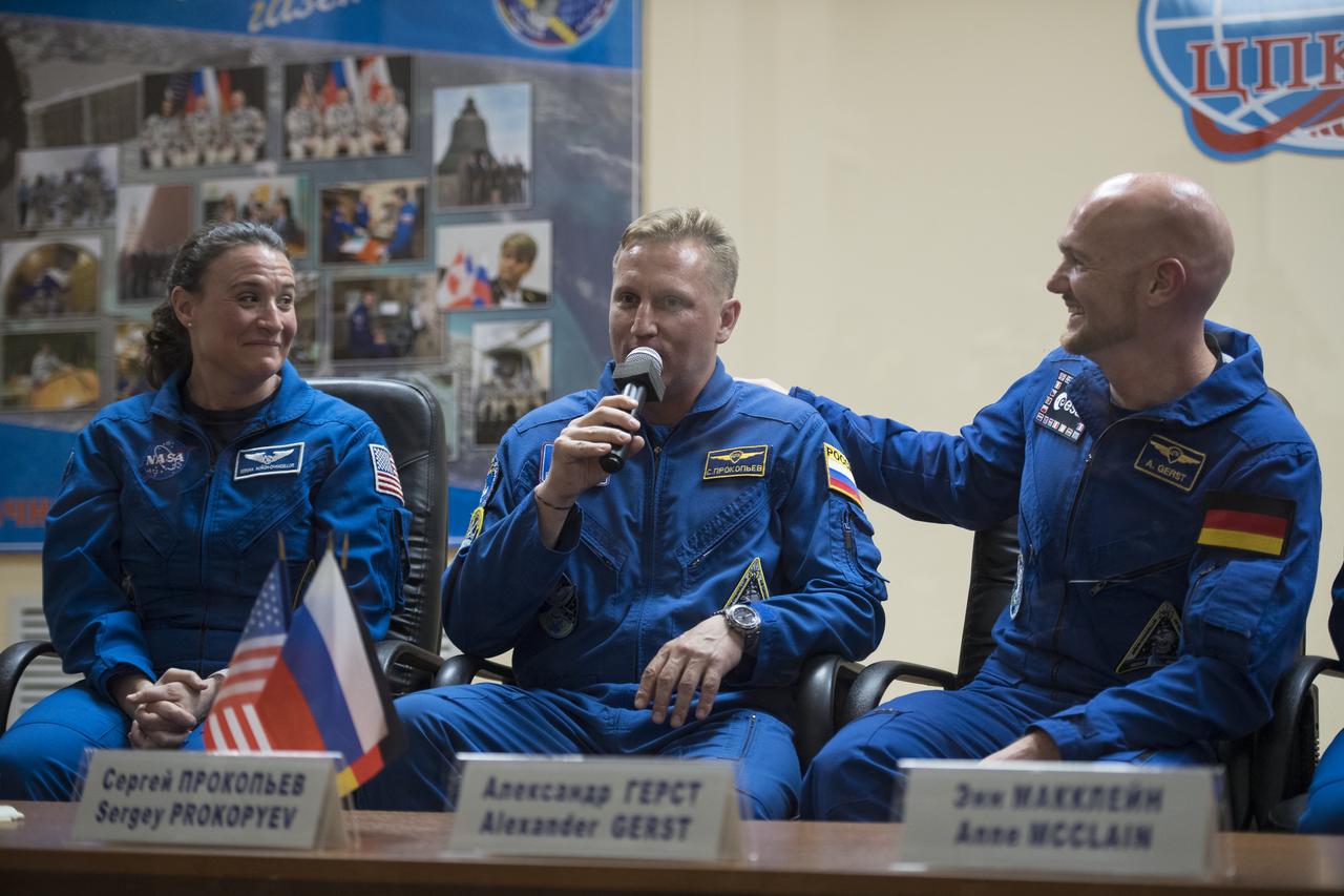 Expedition 56 Soyuz Commander Sergey Prokopyev of Roscosmos, center, answers a question along with flight engineer Serena Auñón-Chancellor of NASA, left, and flight engineer Alexander Gerst of ESA (European Space Agency), right, during a press conference, Tuesday, June 5, 2018 a the Cosmonaut Hotel in Baikonur, Kazakhstan. Auñón-Chancellor, Prokopyev, and Gerst are scheduled to launch to the International Space Station aboard the Soyuz MS-09 spacecraft on Wednesday, June 6.  Photo Credit: (NASA/Joel Kowsky)