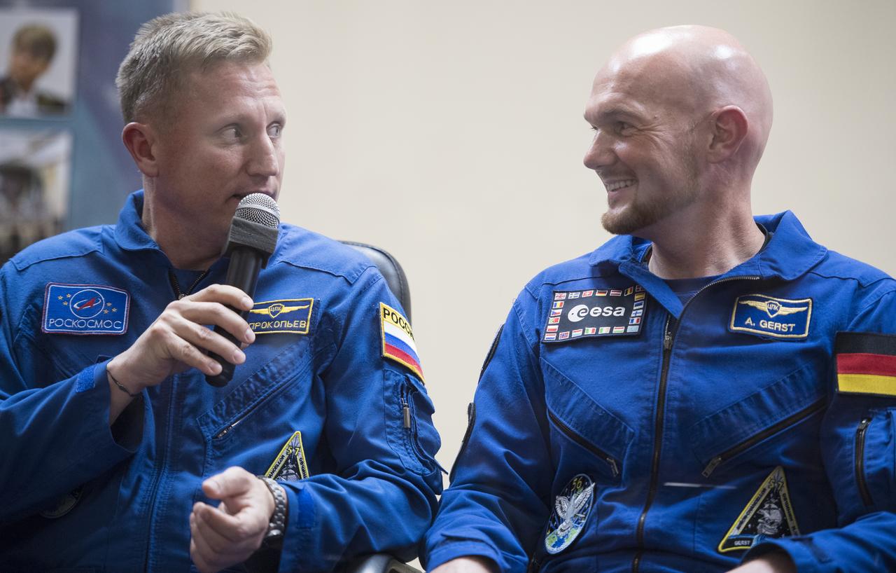 Expedition 56 Soyuz Commander Sergey Prokopyev of Roscosmos, left, and flight engineer Alexander Gerst of ESA (European Space Agency) are seen during a press conference, Tuesday, June 5, 2018 a the Cosmonaut Hotel in Baikonur, Kazakhstan. Expedition 56 Soyuz Commander Sergey Prokopyev of Roscosmos, flight engineer Serena Auñón-Chancellor of NASA, and flight engineer Alexander Gerst of ESA (European Space Agency) are scheduled to launch to the International Space Station aboard the Soyuz MS-09 spacecraft on Wednesday, June 6.  Photo Credit: (NASA/Joel Kowsky)