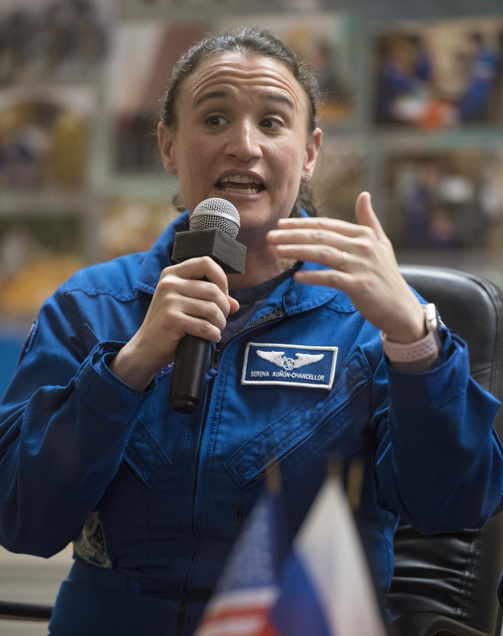 Expedition 56 flight engineer Serena Auñón-Chancellor of NASA answers a question during a press conference, Tuesday, June 5, 2018, Cosmonaut Hotel in Baikonur, Kazakhstan. Auñón-Chancellor, Soyuz Commander Sergey Prokopyev of Roscosmos, and flight engineer Alexander Gerst of ESA (European Space Agency) are scheduled to launch to the International Space Station aboard the Soyuz MS-09 spacecraft on Wednesday, June 6. Photo Credit: (NASA/Joel Kowsky)