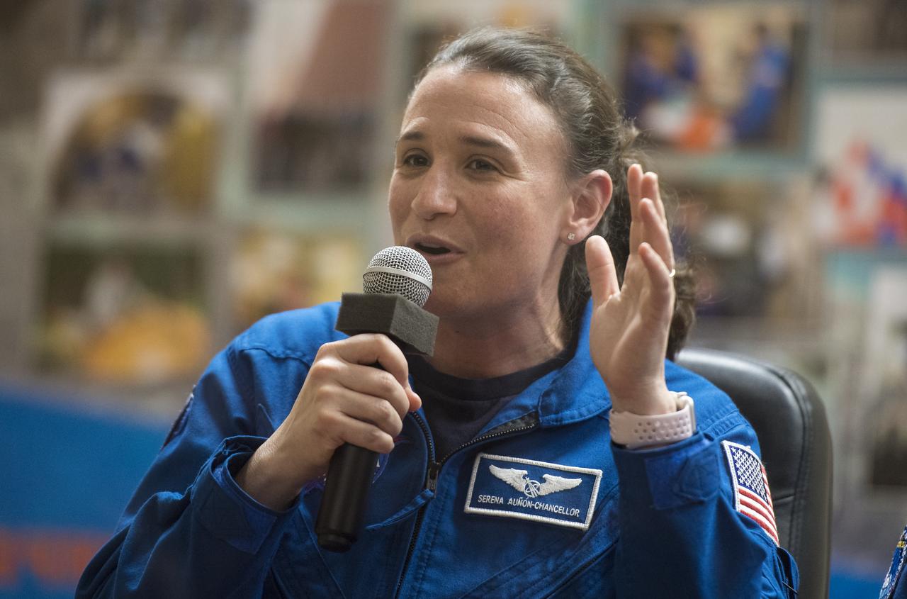Expedition 56 flight engineer Serena Auñón-Chancellor of NASA answers a question during a press conference, Tuesday, June 5, 2018, Cosmonaut Hotel in Baikonur, Kazakhstan. Auñón-Chancellor, Soyuz Commander Sergey Prokopyev of Roscosmos, and flight engineer Alexander Gerst of ESA (European Space Agency) are scheduled to launch to the International Space Station aboard the Soyuz MS-09 spacecraft on Wednesday, June 6. Photo Credit: (NASA/Joel Kowsky)