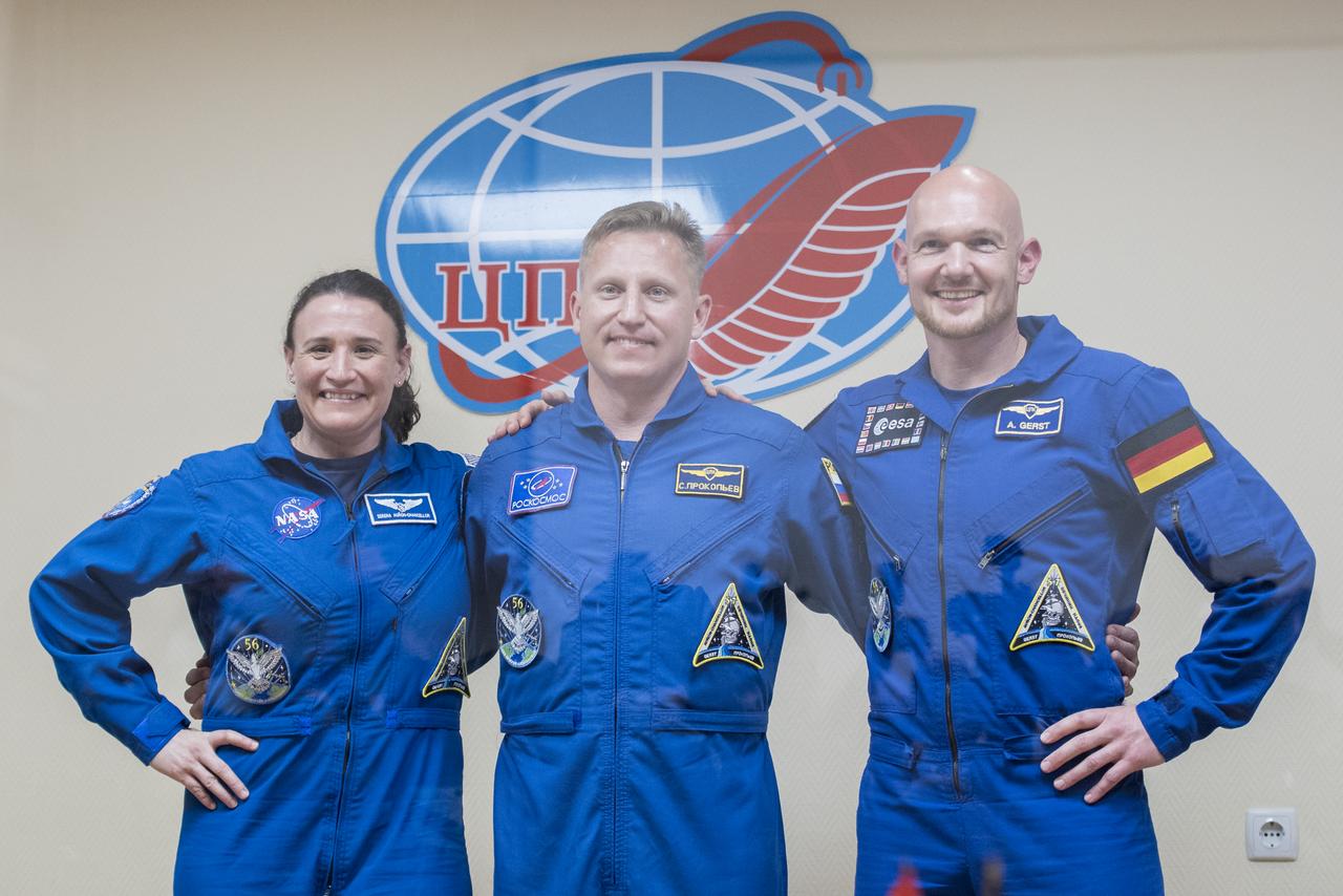 Expedition 56 flight engineer Serena Auñón-Chancellor of NASA, left, Soyuz Commander Sergey Prokopyev of Roscosmos, center, and flight engineer Alexander Gerst of ESA (European Space Agency) pose for a picture following the completion of a press conference, Tuesday, June 5, 2018 a the Cosmonaut Hotel in Baikonur, Kazakhstan. Auñón-Chancellor, Prokopyev, and Gerst are scheduled to launch to the International Space Station aboard the Soyuz MS-09 spacecraft on Wednesday, June 6.  Photo Credit: (NASA/Joel Kowsky)