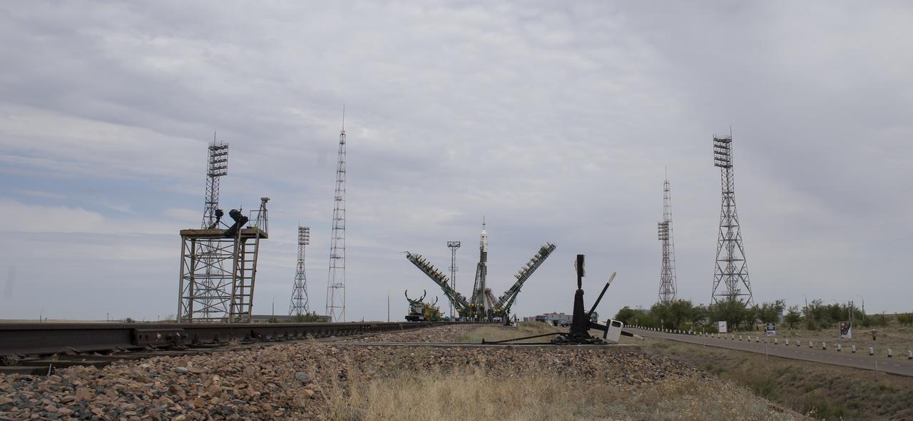 The Soyuz MS-09 rocket is seen as the gantry arms are lowered prior to launch, Wednesday, June 6, 2018 at the Baikonur Cosmodrome in Kazakhstan. Expedition 56 Soyuz Commander Sergey Prokopyev of Roscosmos, flight engineer Serena Auñón-Chancellor of NASA, and flight engineer Alexander Gerst of ESA (European Space Agency) launched at 7:12am EDT (5:12pm Baikonur time) and will spend the next six months living and working aboard the International Space Station. Photo Credit: (NASA/Joel Kowsky)