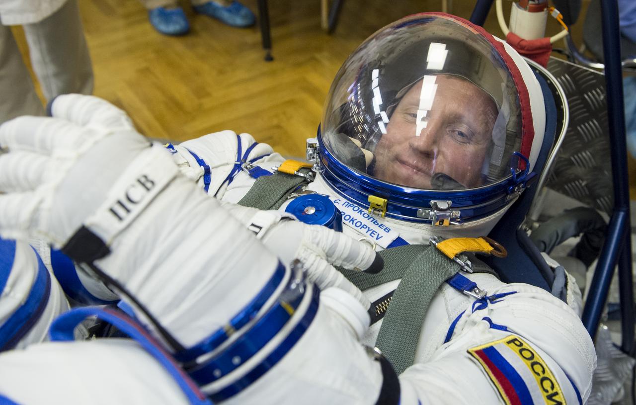 Expedition 56 Soyuz Commander Sergey Prokopyev of Roscosmos has his Russian Sokol suit pressure checked as he and fellow crewmates, Serena Auñón-Chancellor of NASA and Alexander Gerst of ESA (European Space Agency) prepare for their Soyuz launch to the International Space Station, Wednesday, June 6, 2018 at the Baikonur Cosmodrome in Kazakhstan.  Launch of the Soyuz rocket will send Prokopyev, Auñón-Chancellor, and Gerst on a six month mission aboard the International Space Station. Photo Credit: (NASA/GCTC/Andrey Shelepin)