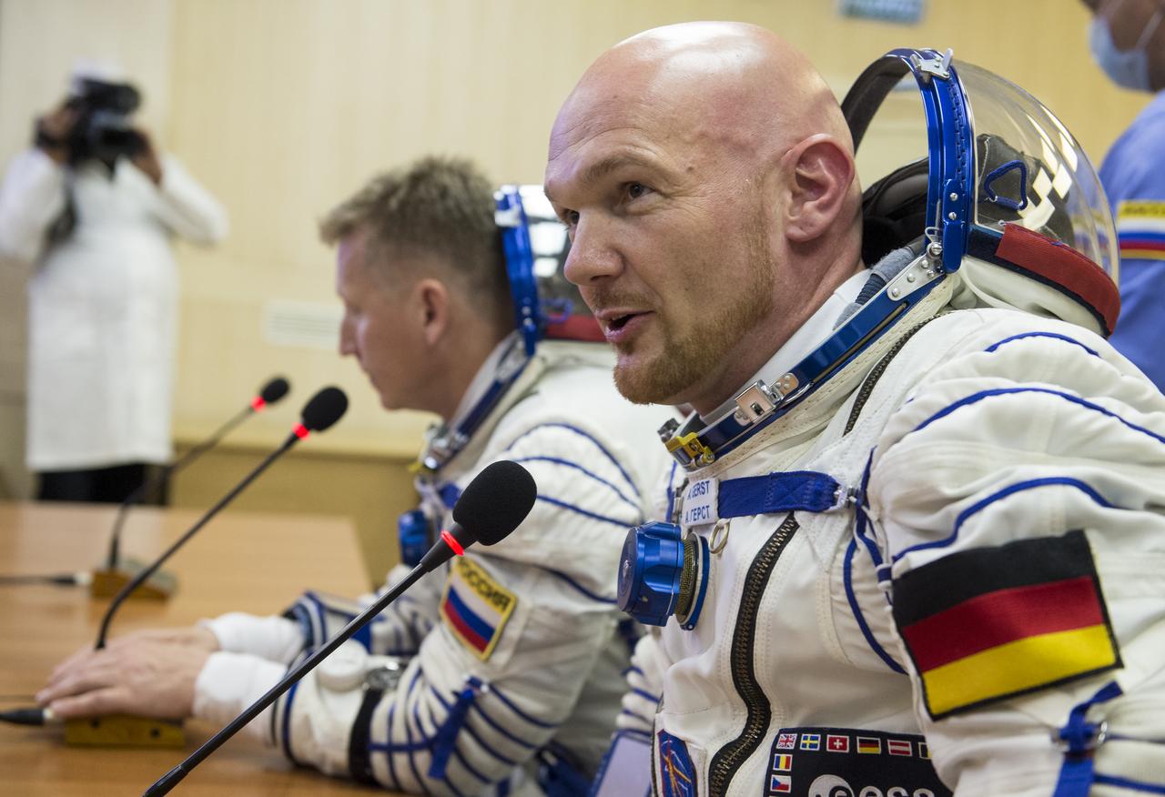 Expedition 56 flight engineer Alexander Gerst of ESA (European Space Agency) talks with family and friends after having his Russian Sokol suit presseur checked as he and fellow crewmates Serena Auñón-Chancellor of NASA and Sergey Prokopyev of Roscosmos prepare for their Soyuz launch to the International Space Station, Wednesday, June 6, 2018 at the Baikonur Cosmodrome in Kazakhstan.  Launch of the Soyuz rocket will send Gerst, Auñón-Chancellor, and Prokopyev on a six month mission aboard the International Space Station. Photo Credit: (NASA/GCTC/Andrey Shelepin)