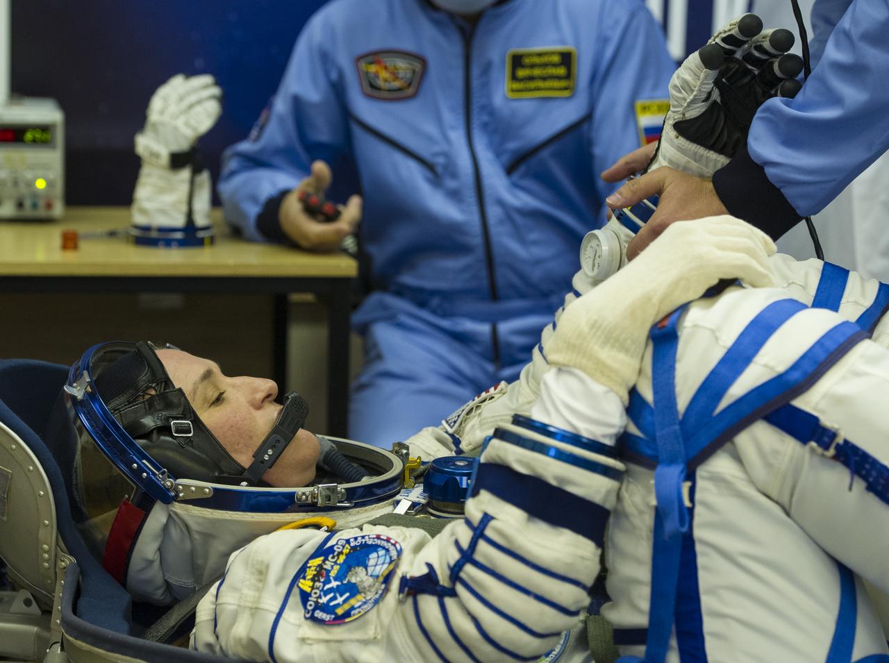 Expedition 56 flight engineer Serena Auñón-Chancellor of NASA is seen as she waits to have her Russian Sokol suit pressure checked as he and fellow crewmates, Sergey Prokopyev of Roscosmos and Alexander Gerst of ESA (European Space Agency) prepare for their Soyuz launch to the International Space Station, Wednesday, June 6, 2018 at the Baikonur Cosmodrome in Kazakhstan. Launch of the Soyuz rocket will send Auñón-Chancellor, Prokopyev, and Gerst on a six month mission aboard the International Space Station. Photo Credit: (NASA/GCTC/Andrey Shelepin)
