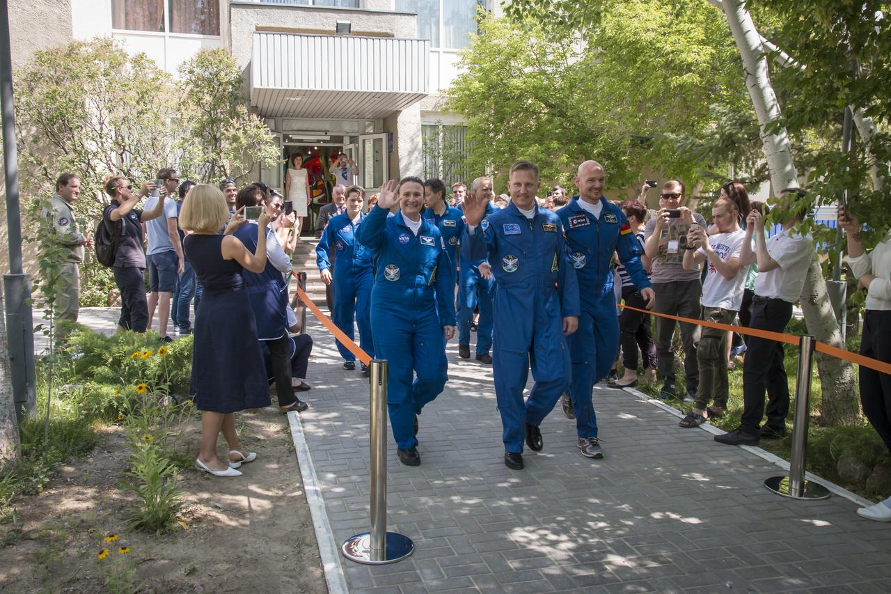 Expedition 56 flight engineer Serena Auñón-Chancellor of NASA, left, Soyuz Commander Sergey Prokopyev of Roscosmos, center, and flight engineer Alexander Gerst of ESA (European Space Agency), right, are seen as depart the Cosmonaut Hotel to suit-up for their Soyuz launch to the International Space Station, Wednesday, June 6, 2018 in Baikonur, Kazakhstan. Auñón-Chancellor, Prokopyev, and Gerst launched aboard the Soyuz MS-09 spacecraft at 7:12am EDT (5:12pm Baikonur time) on June 6 to begin their journey to the International Space Station.  Photo Credit: (NASA/Victor Zelentsov)