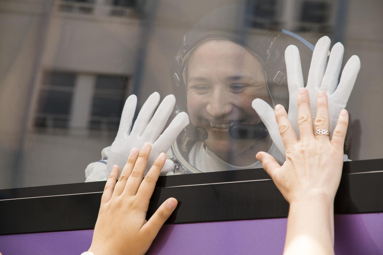 Expedition 56 flight engineer Serena Auñón-Chancellor of NASA waves farewell to family and friends and she and Soyuz Commander Sergey Prokopyev of Roscosmos and flight engineer Alexander Gerst of ESA (European Space Agency) depart Building 254 for the launch pad a few hours before their launch, Wednesday, June 6, 2018 at the Baikonur Cosmodrome in Kazakhstan. Auñón-Chancellor, Prokopyev, and Gerst launched aboard the Soyuz MS-09 spacecraft at 7:12am EDT (5:12pm Baikonur time) on June 6 to begin their journey to the International Space Station. Photo Credit: (NASA/Victor Zelentsov)