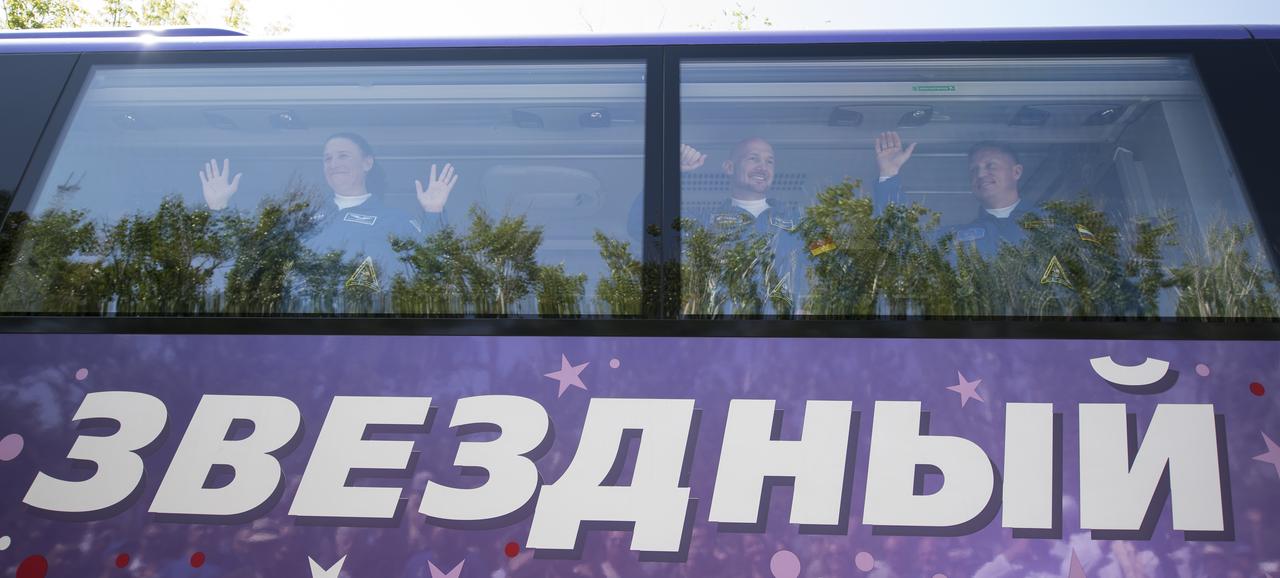 Expedition 56 flight engineer Serena Auñón-Chancellor of NASA, left, flight engineer Alexander Gerst of ESA (European Space Agency), center, and Soyuz Commander Sergey Prokopyev of Roscosmos, right, wave farewell to family and friends as they depart the Cosmonaut Hotel to suit-up for their Soyuz launch to the International Space Station, Wednesday, June 6, 2018 in Baikonur, Kazakhstan. Auñón-Chancellor, Prokopyev, and Gerst launched aboard the Soyuz MS-09 spacecraft at 7:12am EDT (5:12pm Baikonur time) on June 6 to begin their journey to the International Space Station.  Photo Credit: (NASA/Joel Kowsky)