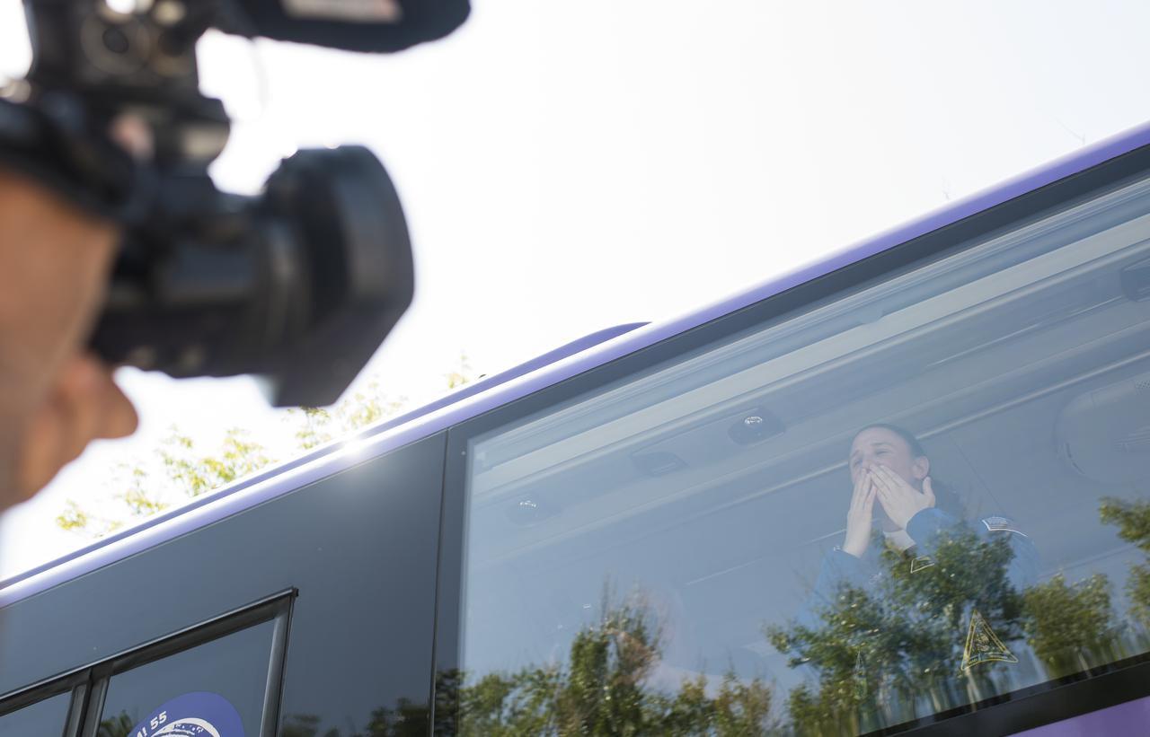 Expedition 56 flight engineer Serena Auñón-Chancellor of NASA waves farewell to family and friends as she and fellow crewmates flight engineer Alexander Gerst of ESA (European Space Agency) and Soyuz Commander Sergey Prokopyev of Roscosmos depart the Cosmonaut Hotel to suit-up for their Soyuz launch to the International Space Station, Wednesday, June 6, 2018 in Baikonur, Kazakhstan. Auñón-Chancellor, Prokopyev, and Gerst launched aboard the Soyuz MS-09 spacecraft at 7:12am EDT (5:12pm Baikonur time) on June 6 to begin their journey to the International Space Station.  Photo Credit: (NASA/Joel Kowsky)