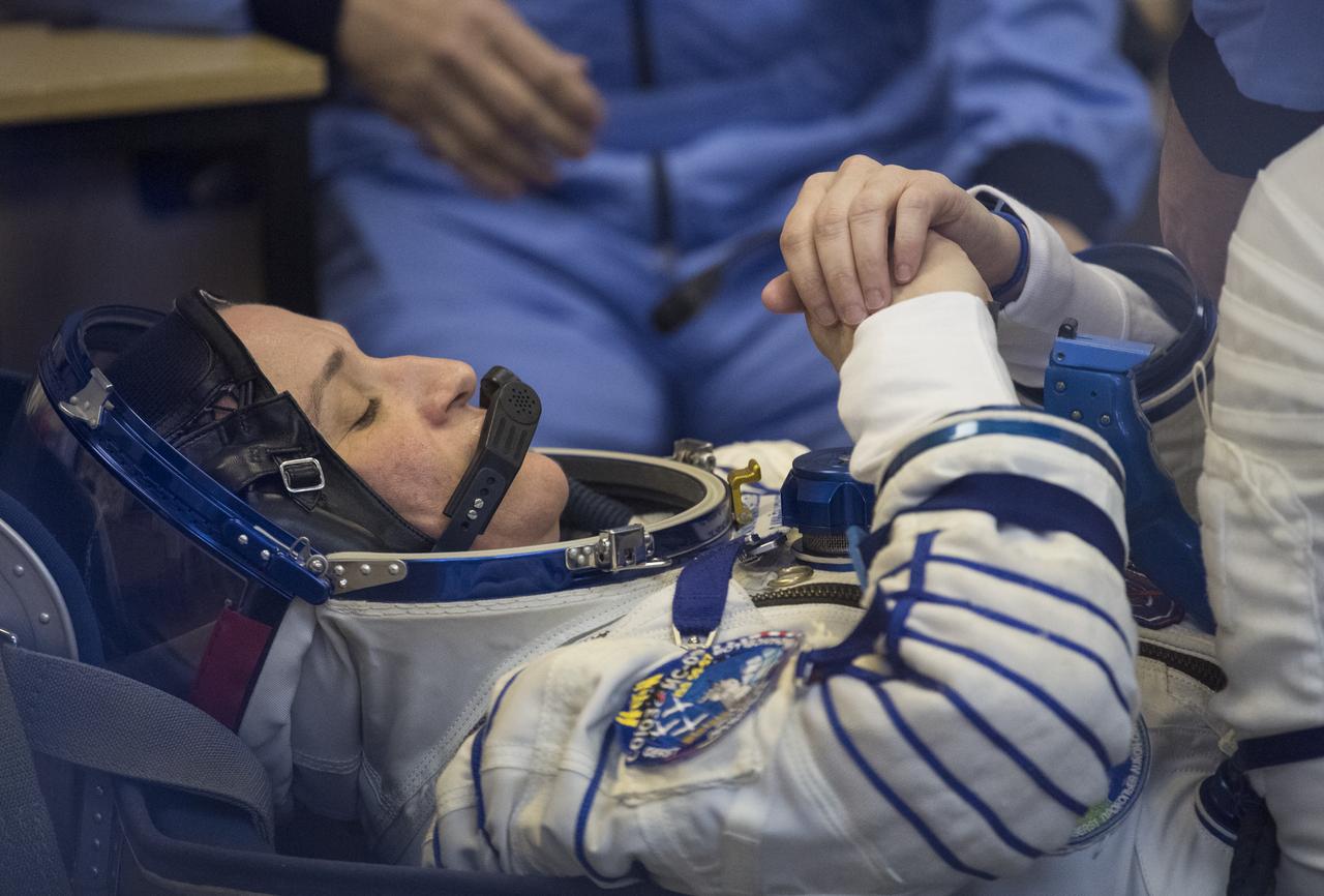 Expedition 56 flight engineer Serena Auñón-Chancellor of NASA prepares to have her Russian Sokol suit pressure checked in preparation for launch aboard the Soyuz MS-09 spacecraft, Wednesday, June 6, 2018 at the Baikonur Cosmodrome in Kazakhstan. Auñón-Chancellor, flight engineer Alexander Gerst of ESA (European Space Agency) and Soyuz Commander Sergey Prokopyev of Roscosmos launched aboard the Soyuz MS-09 spacecraft at 7:12am EDT (5:12pm Baikonur time) on June 6 to begin their journey to the International Space Station. Photo Credit: (NASA/Joel Kowsky)