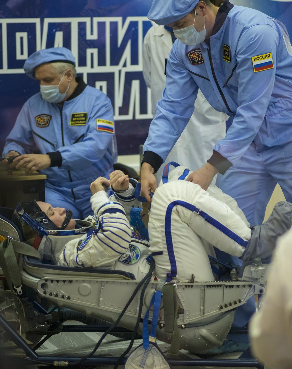 Expedition 56 flight engineer Serena Auñón-Chancellor of NASA prepares to have her Russian Sokol suit pressure checked in preparation for launch aboard the Soyuz MS-09 spacecraft, Wednesday, June 6, 2018 at the Baikonur Cosmodrome in Kazakhstan. Auñón-Chancellor, flight engineer Alexander Gerst of ESA (European Space Agency) and Soyuz Commander Sergey Prokopyev of Roscosmos launched aboard the Soyuz MS-09 spacecraft at 7:12am EDT (5:12pm Baikonur time) on June 6 to begin their journey to the International Space Station. Photo Credit: (NASA/Joel Kowsky)