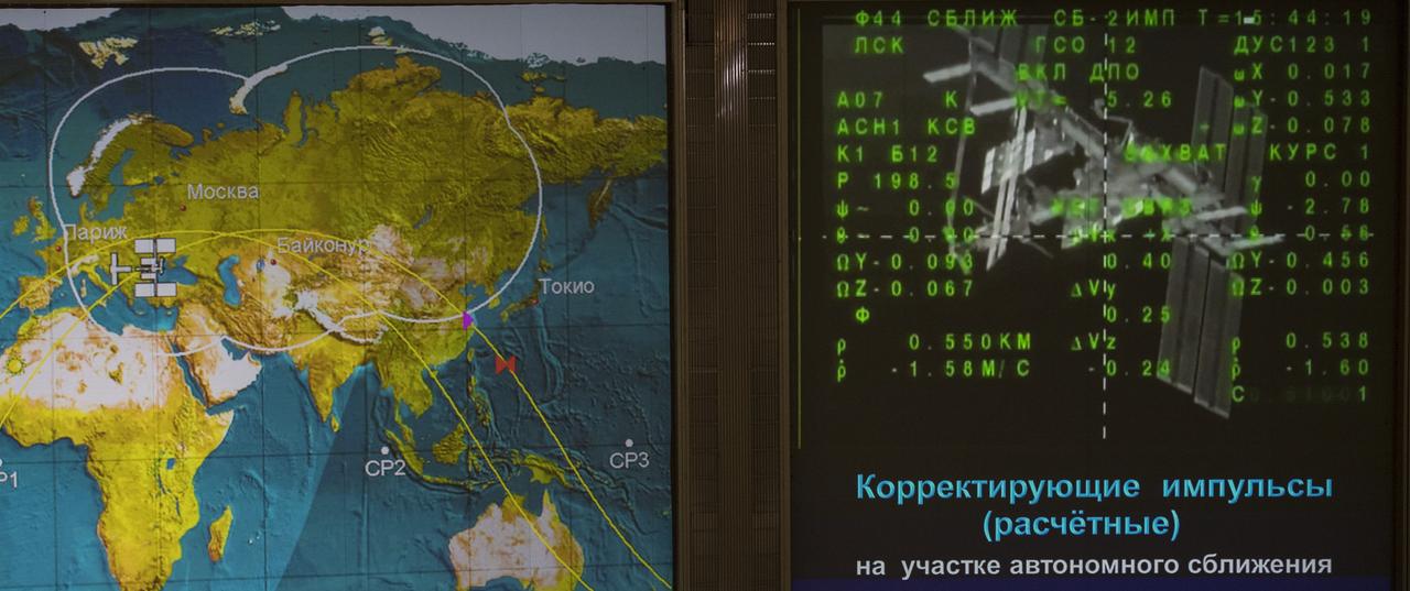 A live view of the International Space Station, as seen by cameras onboard the spacecraft with Expedition 56-57 crewmembers Serena Auñón-Chancellor of NASA, Sergey Prokopyev of Roscosmos, and Alexander Gerst of ESA (European Space Agency) is seen on screens at the Moscow Mission Control Center as the spacecraft approaches for docking, Friday, June 8, 2018 in Korolev, Russia. The Soyuz MS-09 spacecraft carrying Auñón-Chancellor, Prokopyev, and Gerst docked at 9:01am EDT (4:01pm Moscow time) to the Rassvet module of the International Space Station to join Expedition 56 Commander Drew Feustel of NASA and flight engineers Ricky Arnold of NASA and Oleg Artemyev of Roscosmos. Photo Credit: (NASA/Joel Kowsky)