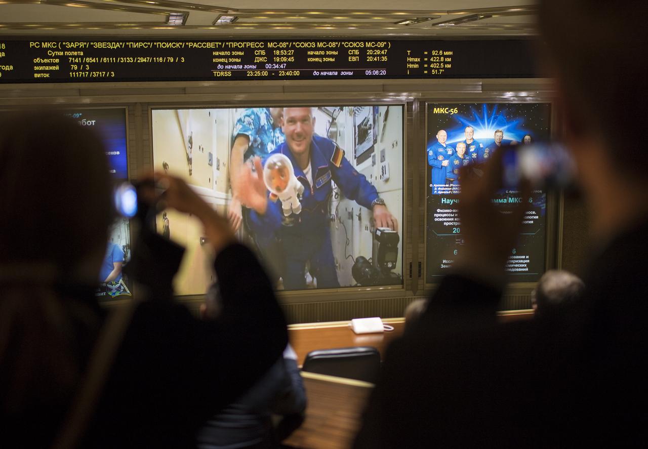 Expedition 56 flight engineer Alexander Gerst of ESA (European Space Agency) is seen after the hatches were opened between the Soyuz MS-09 spacecraft and the International Space Station on screens at the Moscow Mission Control Center in Korolev, Russia a few hours after the Soyuz MS-09 docked to the International Space Station on Friday, June 8, 2018. Hatches were opened at 11:17am EDT (6:17pm Moscow time) and Gerst, Serena Auñón-Chancellor of NASA, and Sergey Prokopyev of Roscosmos joined Expedition 56 Commander Drew Feustel of NASA, Ricky Arnold of NASA, and Oleg Artemyev of Roscosmos onboard the orbiting laboratory.  Photo Credit: (NASA/Joel Kowsky)