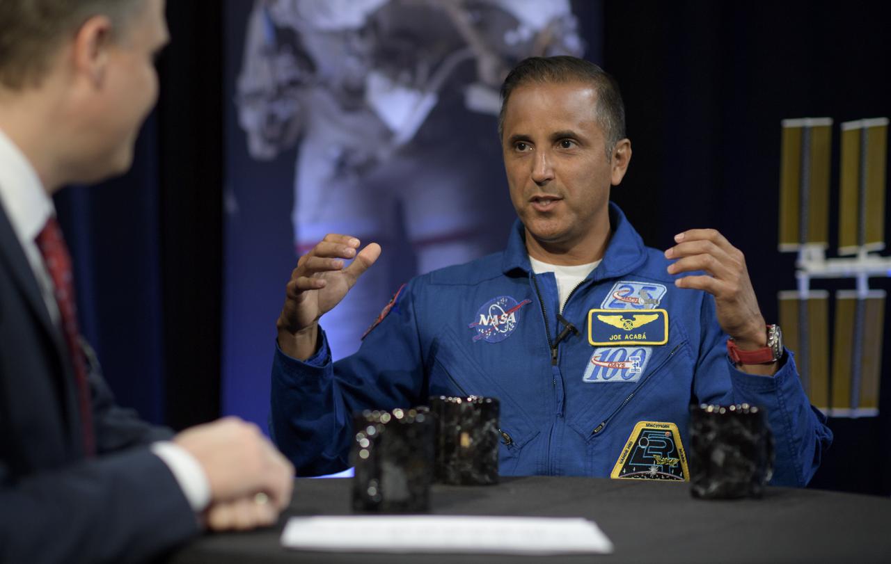 NASA Administrator Jim Bridenstine, left, meets with Expedition 54 NASA astronauts Joe Acaba, right, and Mark Vande Hei, off camera, during their Expedition 54 post flight, Wednesday, June 13, 2018 at NASA Headquarters, Washington. Photo Credit: (NASA/Bill Ingalls)