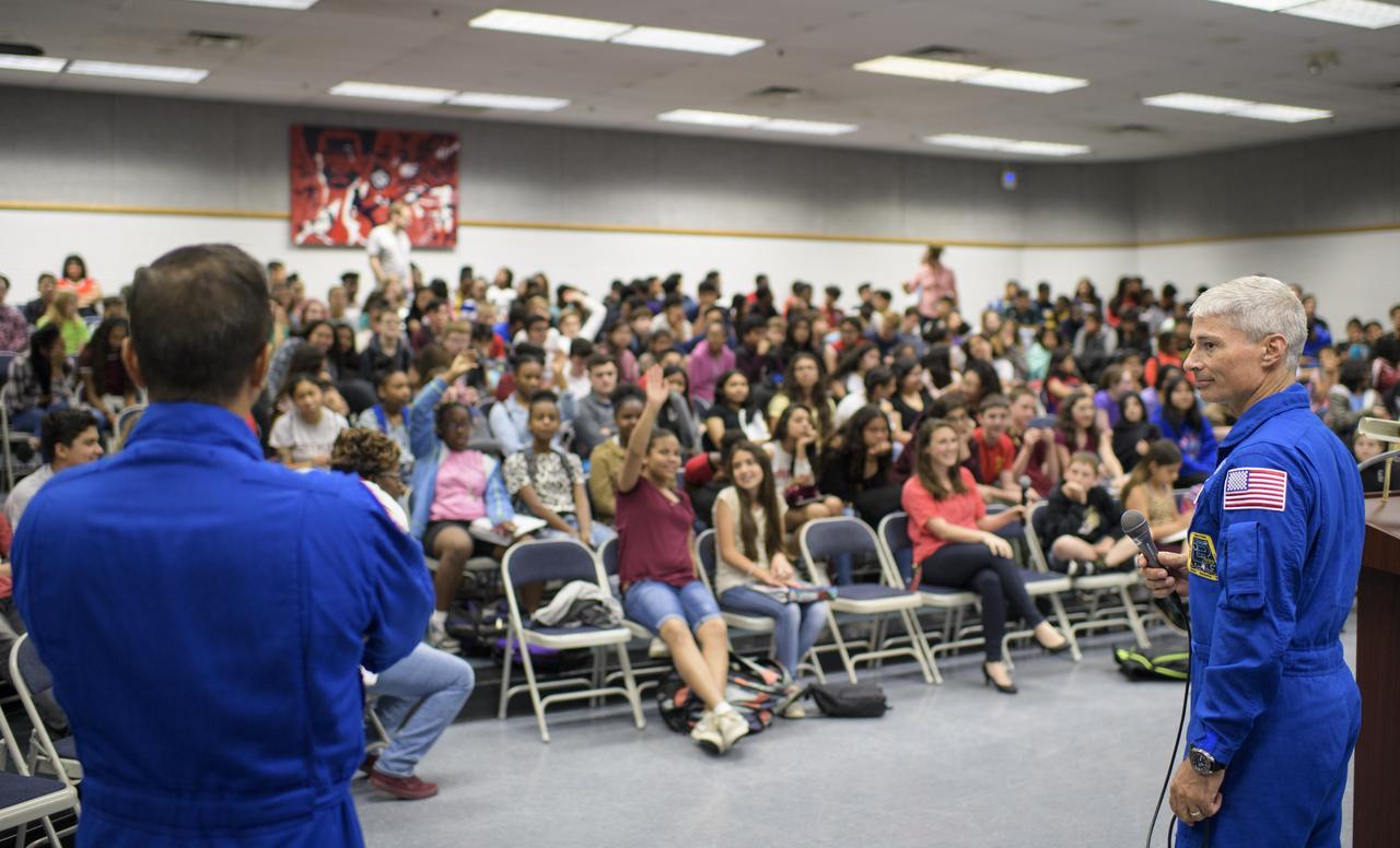NASA astronauts Mark Vande Hei, right, and Joe Acaba answer questions during a presentation to students at Walt Whitman Middle School, Thursday, June 14, 2018 in Alexandria, Va. Acaba and astronaut Mark Vande Hei answered questions from the audience and spoke about their experiences aboard the International Space Station for 168 days as part of Expedition 53 and 54. Photo Credit: (NASA/Joel Kowsky)