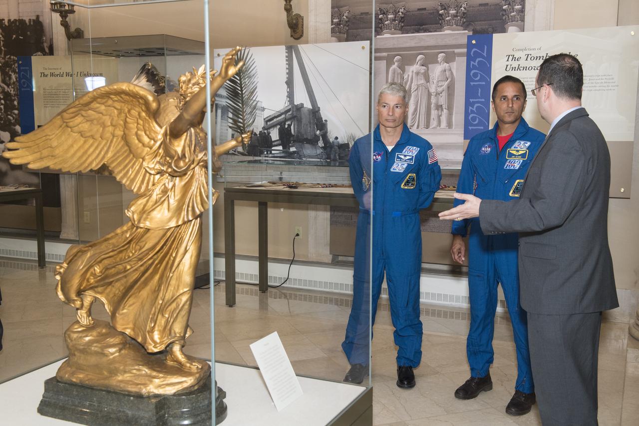 NASA astronauts Mark Vande Hei, left, and Joe Acaba, center, tour the museum at the Tomb of the Unknowns, Friday, June 15, 2018 at Arlington National Cemetery in Arlington, Va. Photo Credit: (NASA/Aubrey Gemignani)
