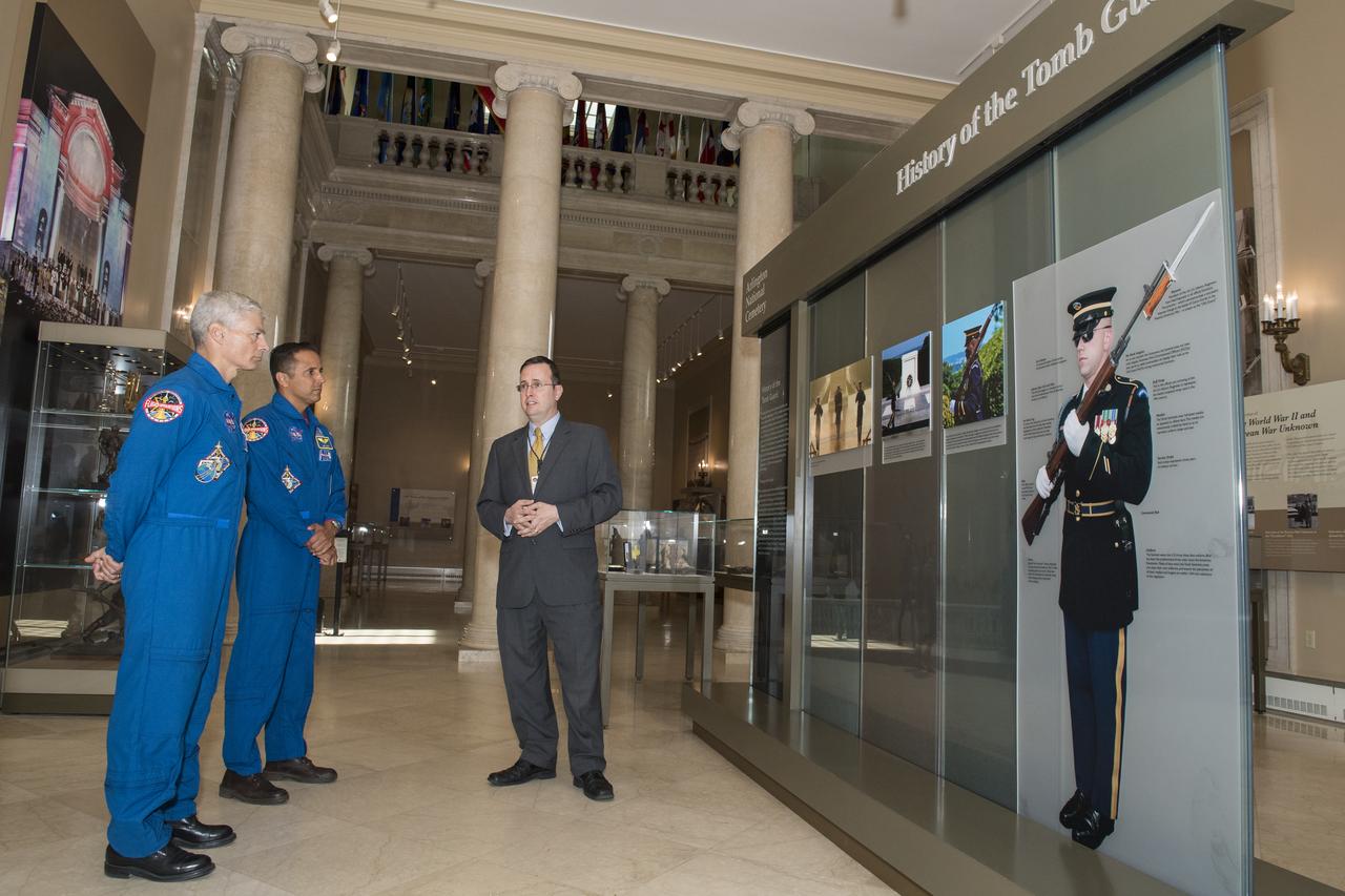Tim Frank describes the history of the Tomb Guard to NASA astronauts Mark Vande Hei, left, and Joe Acaba, center, Friday, June 15, 2018 at Arlington National Cemetery in Arlington, Va. Photo Credit: (NASA/Aubrey Gemignani)