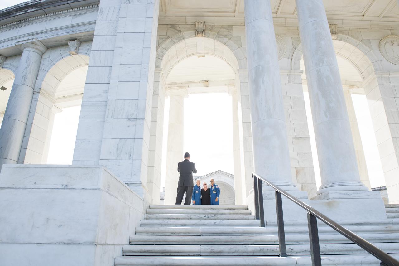 NASA astronauts Mark Vande Hei, left, Julie Vande Hei, center, and Joe Acaba pose for a photo at the amphitheater at Arlington National Cemetery, Friday, June 15, 2018 in Arlington, Va. Photo Credit: (NASA/Aubrey Gemignani)