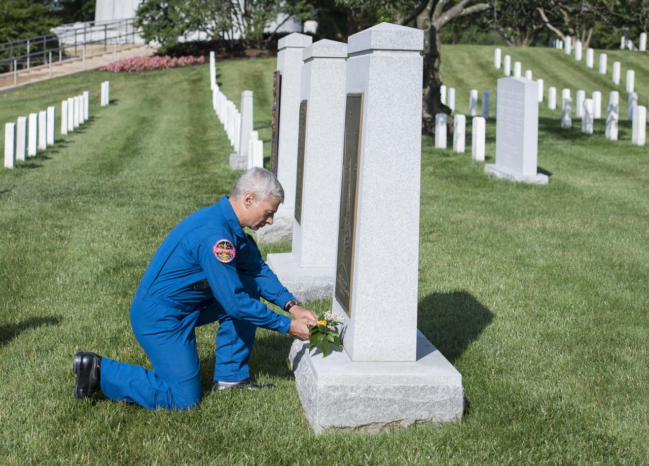 NASA astronaut Mark Vande Hei places a flower at the Space Shuttle Columbia Memorial, Friday, June 15, 2018 at Arlington National Cemetery in Arlington, Va. Photo Credit: (NASA/Aubrey Gemignani)