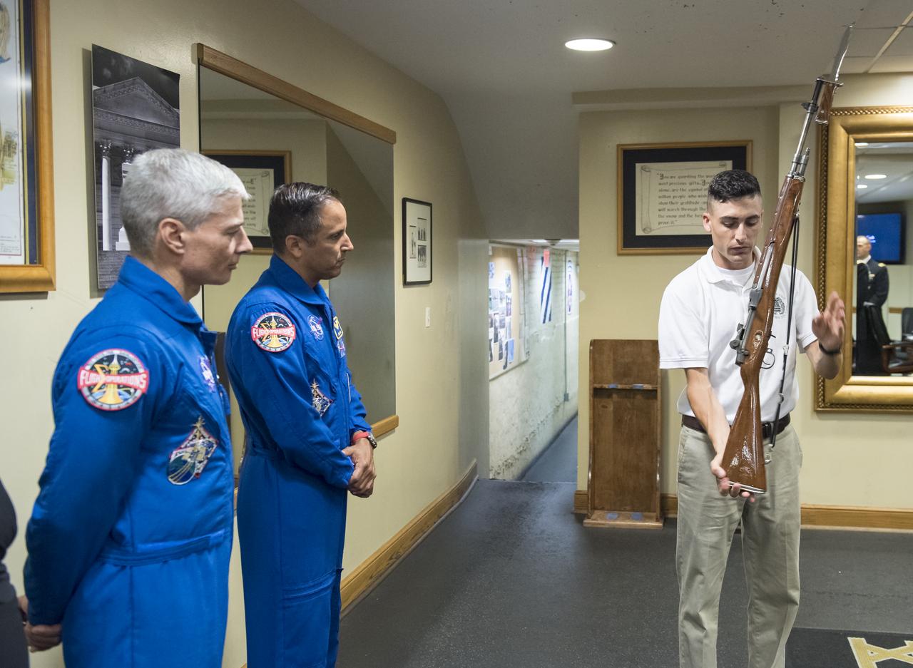 NASA astronauts Mark Vande Hei, left, and Joe Acaba, center, listen as Sergeant Craig Hudson explains the tradition of the Honor Guard at the Tomb of the Unknowns, Friday, June 15, 2018 at the Arlington National Cemetery in Arlington, Va. Photo Credit: (NASA/Aubrey Gemignani)