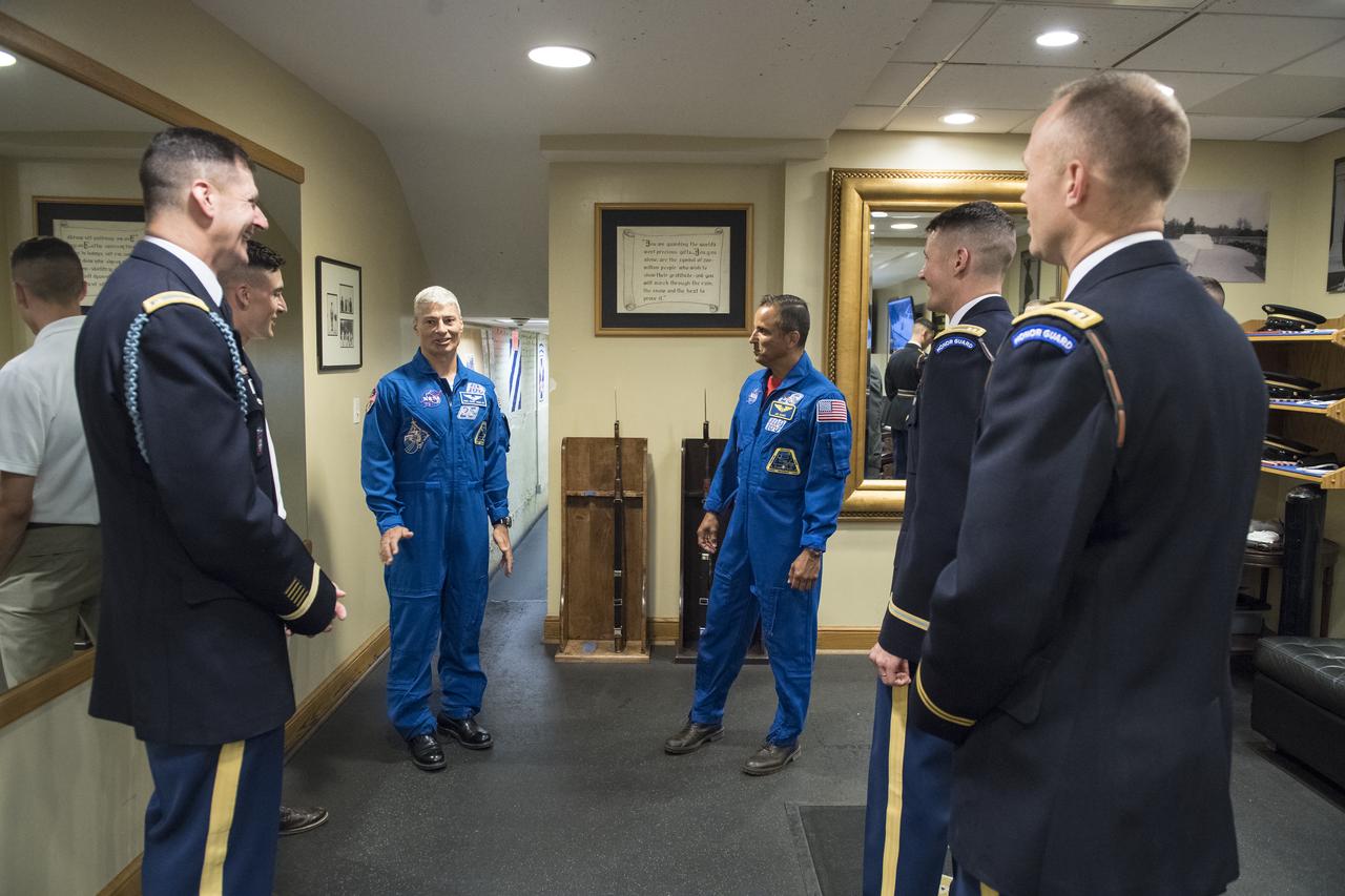NASA astronauts Mark Vande Hei, third from left, and Joe Acaba, third from right, meet with the Honor Guard at the Tomb of the Unknowns, Friday, June 15, 2018 at the Arlington National Cemetery in Arlington, Va. Photo Credit: (NASA/Aubrey Gemignani)