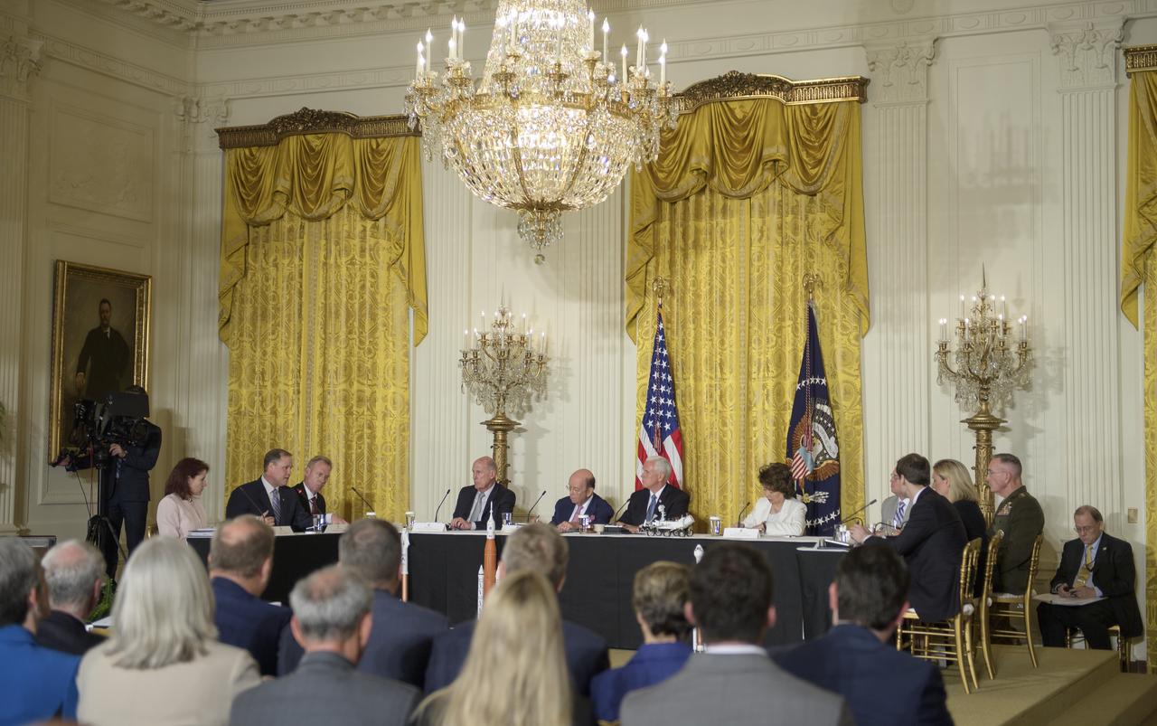 NASA Administrator Jim Bridenstine, second from left, speaks during a meeting of the National Space Council in the East Room of the White House, Monday, June 18, 2018, in Washington. Chaired by the Vice President, the council's role is to advise the President regarding national space policy and strategy, and review the nation's long-range goals for space activities. Photo Credit: (NASA/Bill Ingalls)