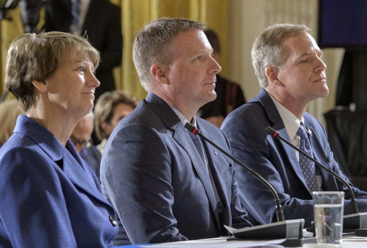Former NASA astronauts Eileen Collins, left, Terry Virts, center, and Scott Parazynski are seen during a meeting of the National Space Council in the East Room of the White House, Monday, June 18, 2018, in Washington. Chaired by the Vice President, the council's role is to advise the President regarding national space policy and strategy, and review the nation's long-range goals for space activities. Photo Credit: (NASA/Bill Ingalls)