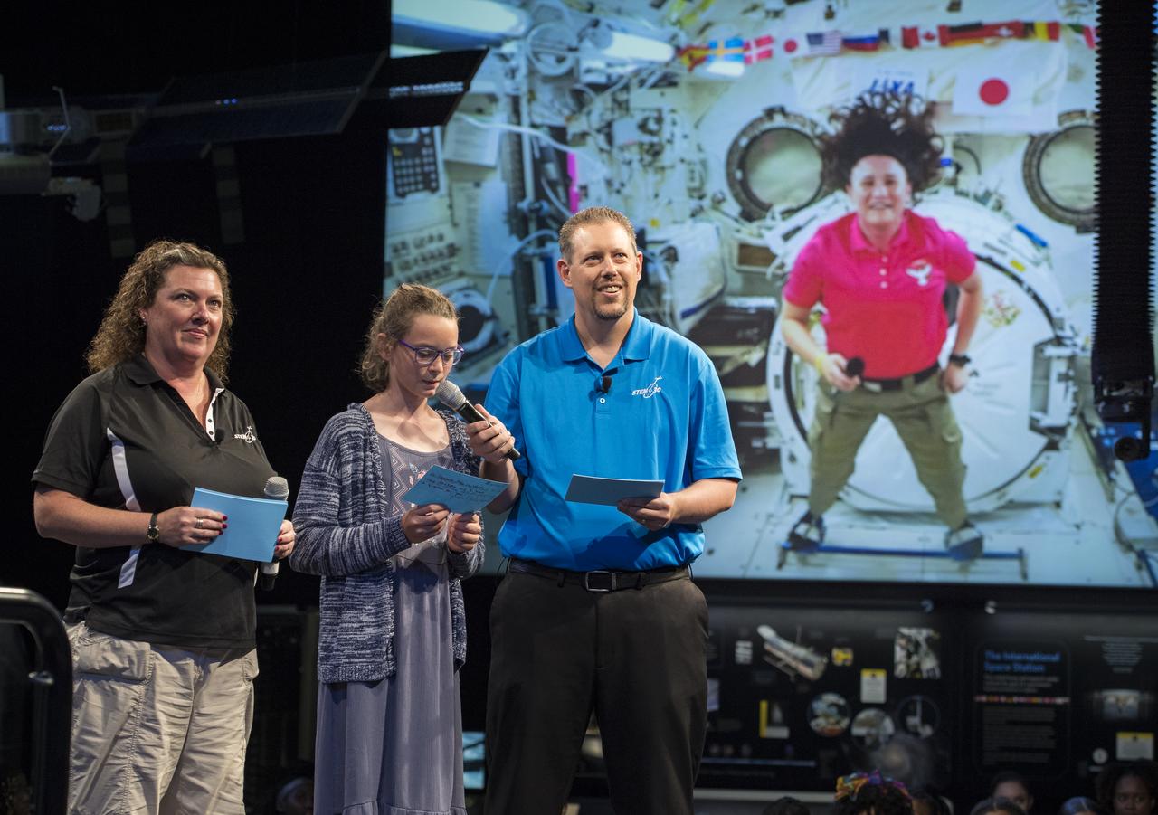 NASA astronaut Serena Auñon-Chancellor's niece, Anna Sophia, surprises her by asking her a question during a live downlink with the International Space Station (ISS), Wednesday, June 27, 2018 at Smithsonian's National Air and Space Museum in Washington. Serena is part of the Expedition 56/57 crew that launched to the ISS June 6, 2018. Photo Credit: (NASA/Aubrey Gemignani)