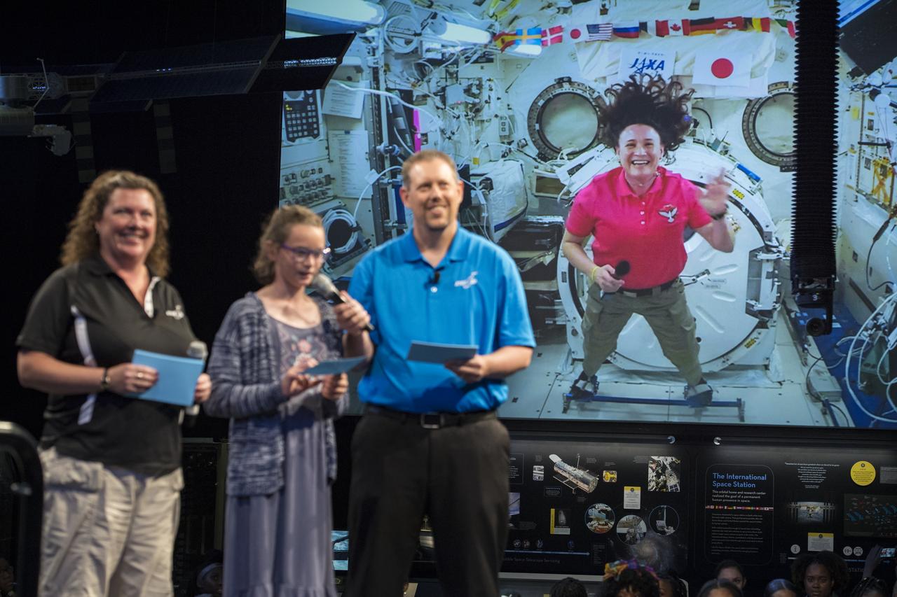 NASA astronaut Serena Auñon-Chancellor's niece, Anna Sophia, surprises her by asking her a question during a live downlink with the International Space Station (ISS), Wednesday, June 27, 2018 at Smithsonian's National Air and Space Museum in Washington. Serena is part of the Expedition 56/57 crew that launched to the ISS June 6, 2018. Photo Credit: (NASA/Aubrey Gemignani)