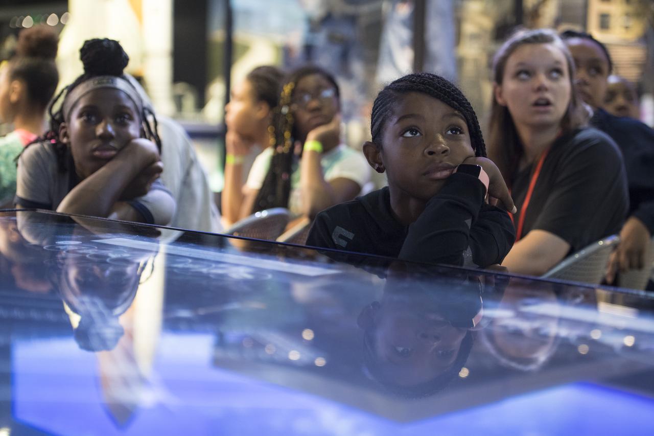 Audience members listen during a STEM in 30 event where NASA astronaut Serena Auñon-Chancellor spoke to students while onboard the International Space Station (ISS), Wednesday, June 27, 2018 at Smithsonian's National Air and Space Museum in Washington. Serena is part of the Expedition 56/57 crew that launched to the ISS June 6, 2018. Photo Credit: (NASA/Aubrey Gemignani)