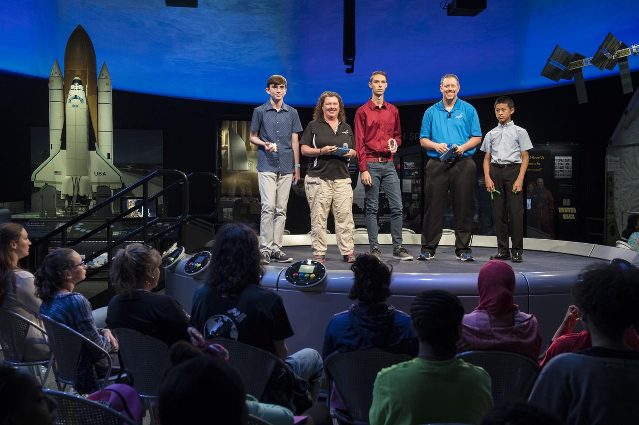 Future Engineers "Two for the Crew" competition winners, Ansel Austin, left, Austin Suder, center, and Jason Qin, right, are seen onstage during a STEM in 30 event, Wednesday, June 27, 2018 at Smithsonian's National Air and Space Museum in Washington. Photo Credit: (NASA/Aubrey Gemignani)