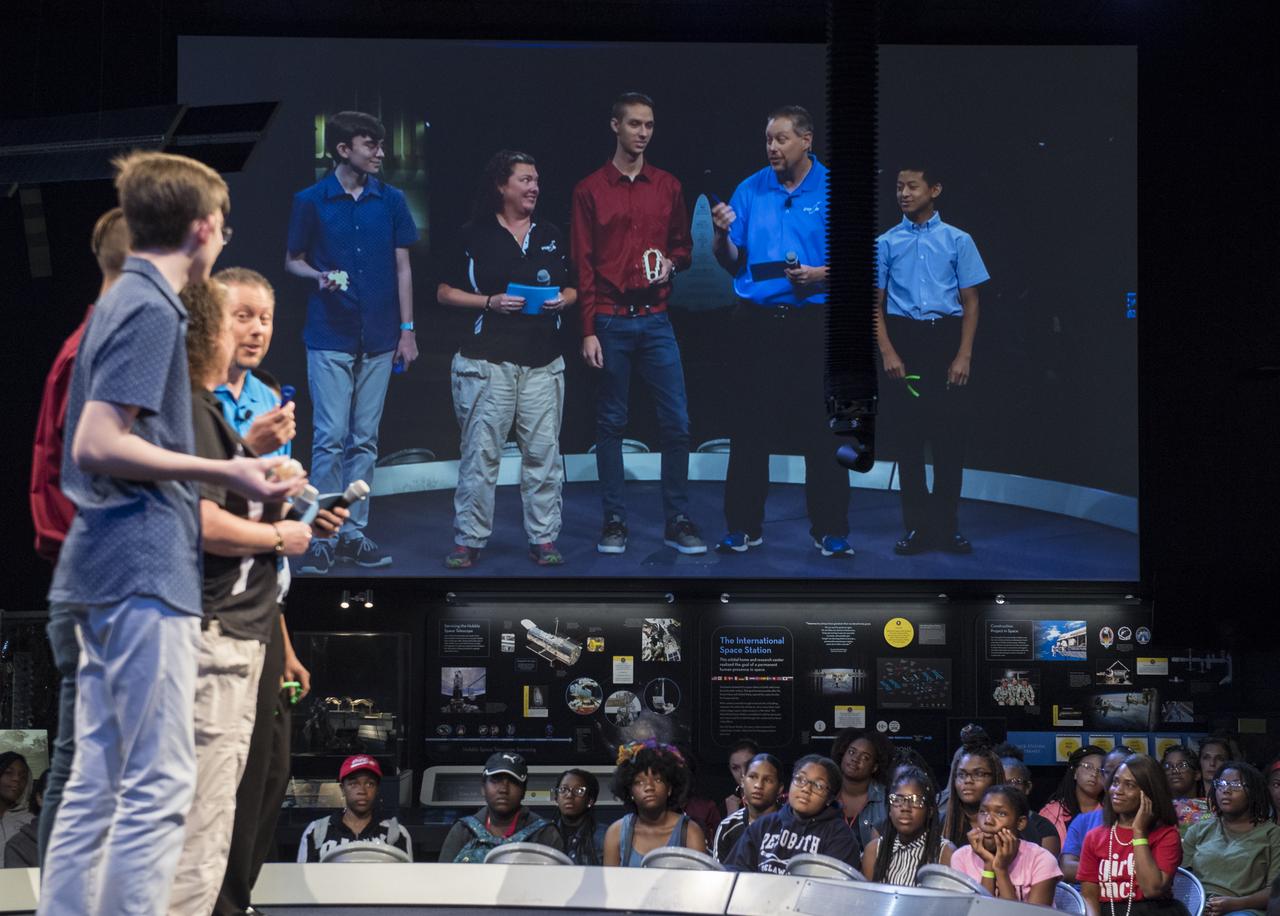Future Engineers "Two for the Crew" competition winners, Ansel Austin, left, Austin Suder, center, and Jason Qin, right, are seen onstage during a STEM in 30 event, Wednesday, June 27, 2018 at Smithsonian's National Air and Space Museum in Washington. Photo Credit: (NASA/Aubrey Gemignani)