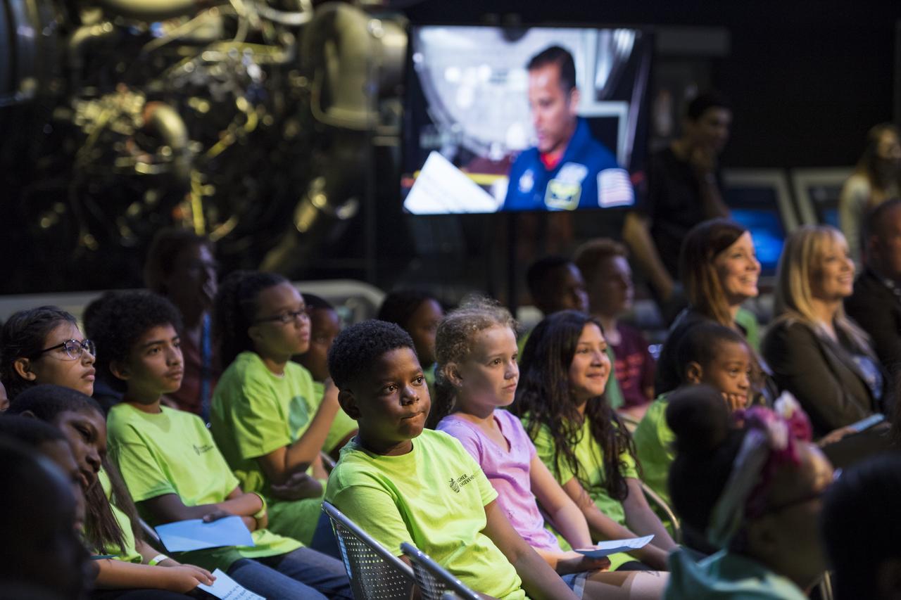 Students watch a video about NASA astronaut Joe Acaba during a STEM in 30 event, Wednesday, June 27, 2018 at Smithsonian's National Air and Space Museum in Washington. Photo Credit: (NASA/Aubrey Gemignani)
