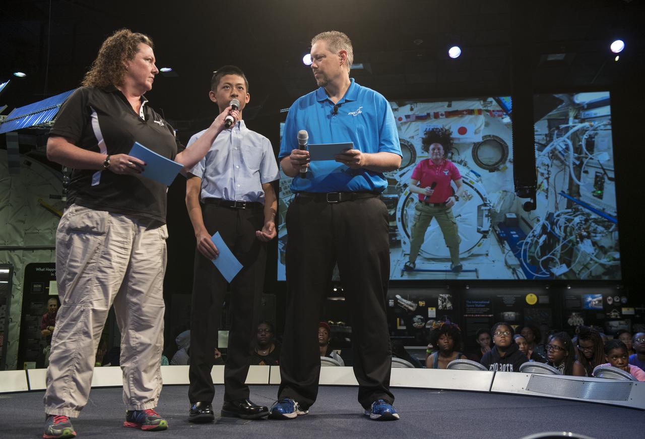 Future Engineers "Two for the Crew" winner Jason Qin asks NASA astronaut Serena Auñon-Chancellor a question during a live downlink with the International Space Station (ISS), Wednesday, June 27, 2018 at Smithsonian's National Air and Space Museum in Washington. Serena is part of the Expedition 56/57 crew that launched to the ISS June 6, 2018. Photo Credit: (NASA/Aubrey Gemignani)