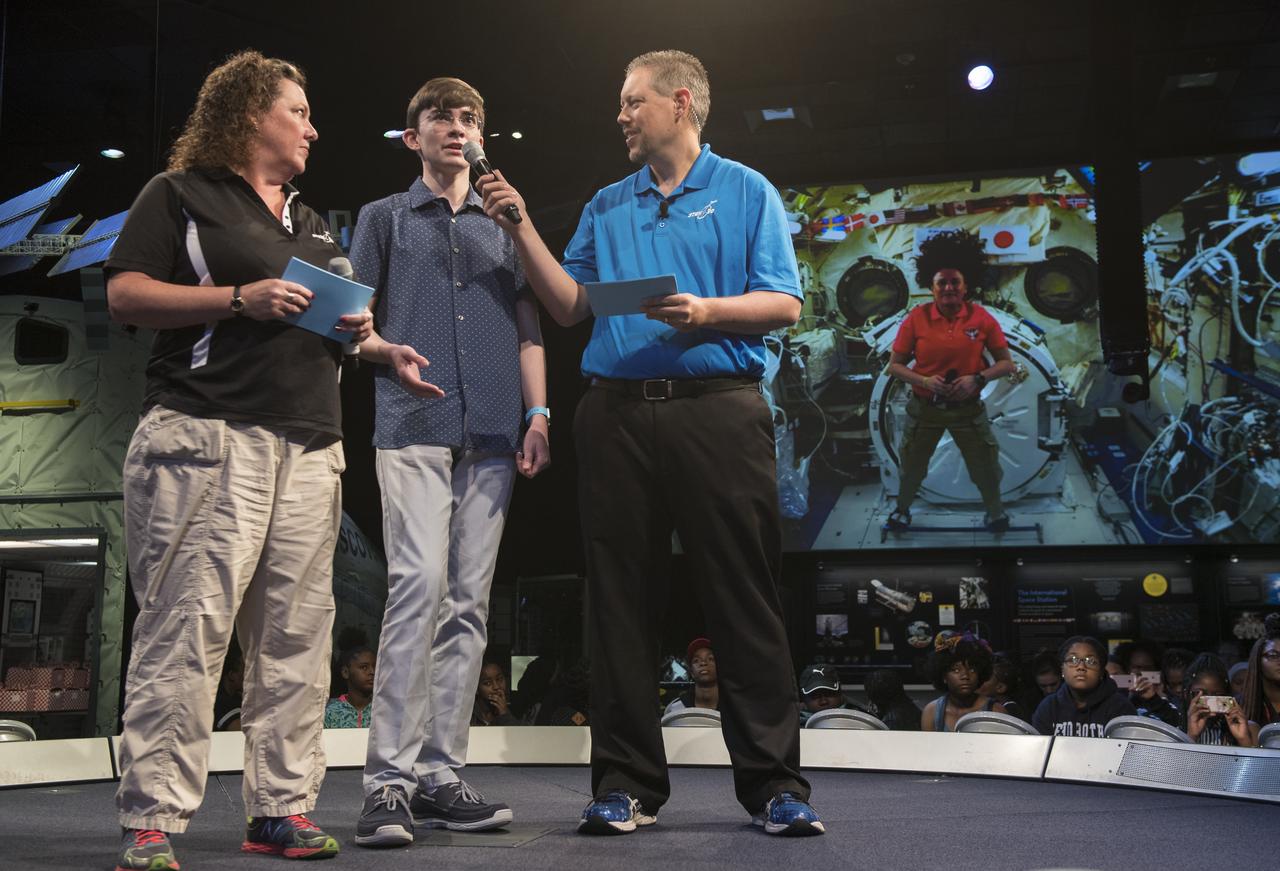 Future Engineers "Two for the Crew" winner Ansel Austin asks NASA astronaut Serena Auñon-Chancellor a question during a live downlink with the International Space Station (ISS), Wednesday, June 27, 2018 at Smithsonian's National Air and Space Museum in Washington. Serena is part of the Expedition 56/57 crew that launched to the ISS June 6, 2018. Photo Credit: (NASA/Aubrey Gemignani)