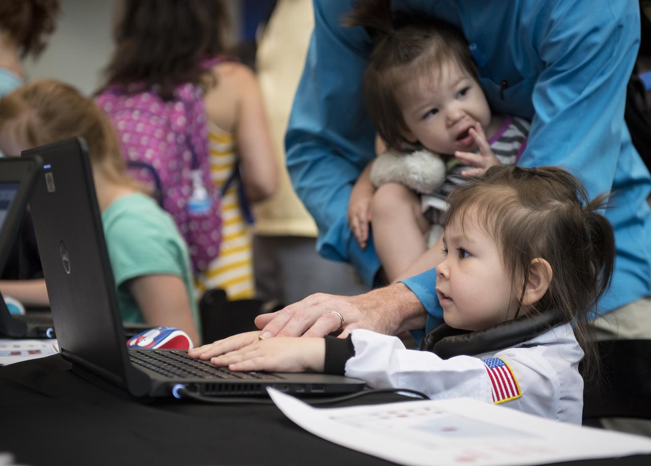 Visitors explore the activities in the Space Race Gallery at Smithsonian's National Air and Space Museum, Wednesday, June 27, 2018 in Washington. Photo Credit: (NASA/Aubrey Gemignani)