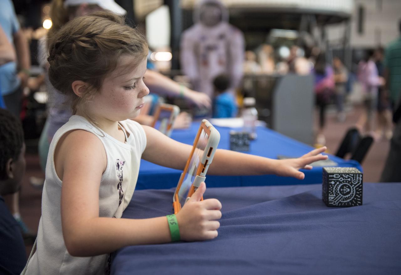 Visitors explore the activities in the Space Race Gallery at Smithsonian's National Air and Space Museum, Wednesday, June 27, 2018 in Washington. Photo Credit: (NASA/Aubrey Gemignani)