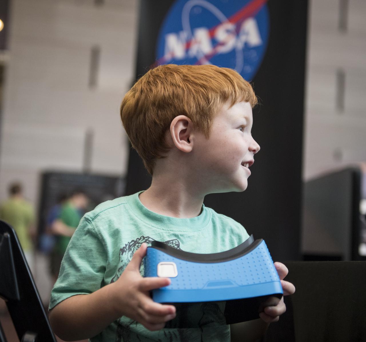 Visitors explore the activities in the Space Race Gallery at Smithsonian's National Air and Space Museum, Wednesday, June 27, 2018 in Washington. Photo Credit: (NASA/Aubrey Gemignani)