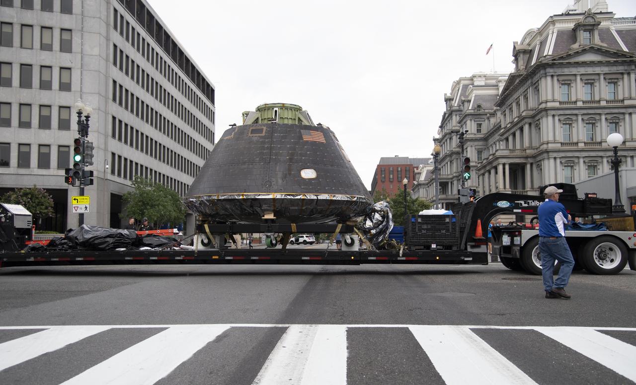 NASA's Orion spacecraft that flew Exploration Flight Test-1 on Dec. 5, 2014 is seen as it arrives at the White House complex, Saturday, July 21, 2018 in Washington, DC. Lockheed Martin, NASA’s prime contractor for Orion, began manufacturing the Orion crew module in 2011 and delivered it in July 2012 to NASA's Kennedy Space Center where final assembly, integration and testing was completed. More than 1,000 companies across the country manufactured or contributed elements to the spacecraft. Photo Credit: (NASA/Joel Kowsky)