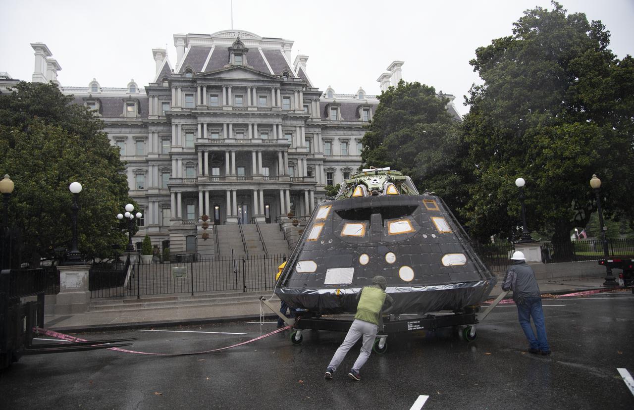 NASA's Orion spacecraft that flew Exploration Flight Test-1 on Dec. 5, 2014 is seen in front of the Eisenhower Executive Office Building on the White House complex, Saturday, July 21, 2018 in Washington, DC. Lockheed Martin, NASA’s prime contractor for Orion, began manufacturing the Orion crew module in 2011 and delivered it in July 2012 to NASA's Kennedy Space Center where final assembly, integration and testing was completed. More than 1,000 companies across the country manufactured or contributed elements to the spacecraft. Photo Credit: (NASA/Joel Kowsky)