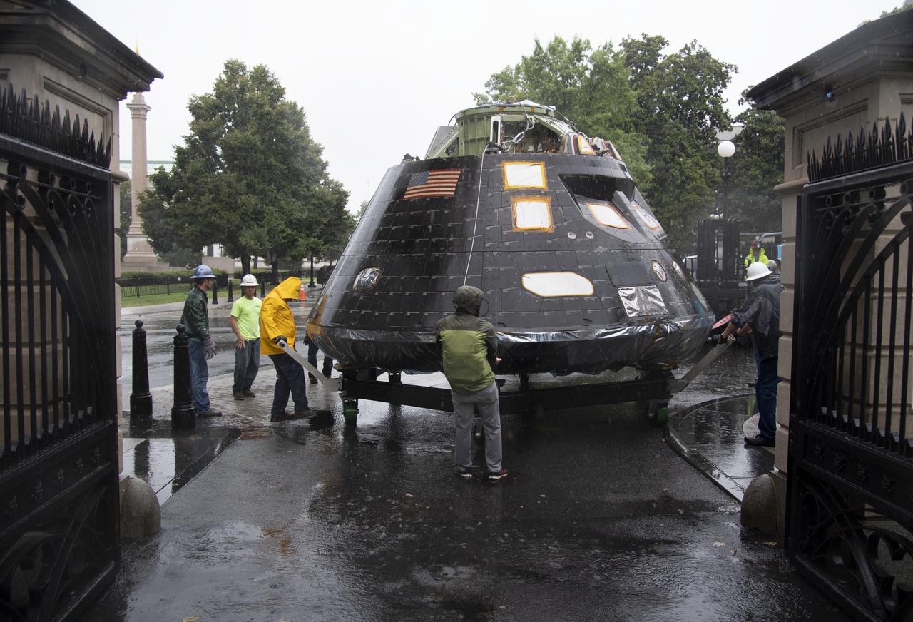NASA's Orion spacecraft that flew Exploration Flight Test-1 on Dec. 5, 2014 is seen while being moved into position to be lifted over a gate and onto the South Lawn of the White House, Saturday, July 21, 2018 in Washington, DC. Lockheed Martin, NASA’s prime contractor for Orion, began manufacturing the Orion crew module in 2011 and delivered it in July 2012 to NASA's Kennedy Space Center where final assembly, integration and testing was completed. More than 1,000 companies across the country manufactured or contributed elements to the spacecraft. Photo Credit: (NASA/Joel Kowsky)