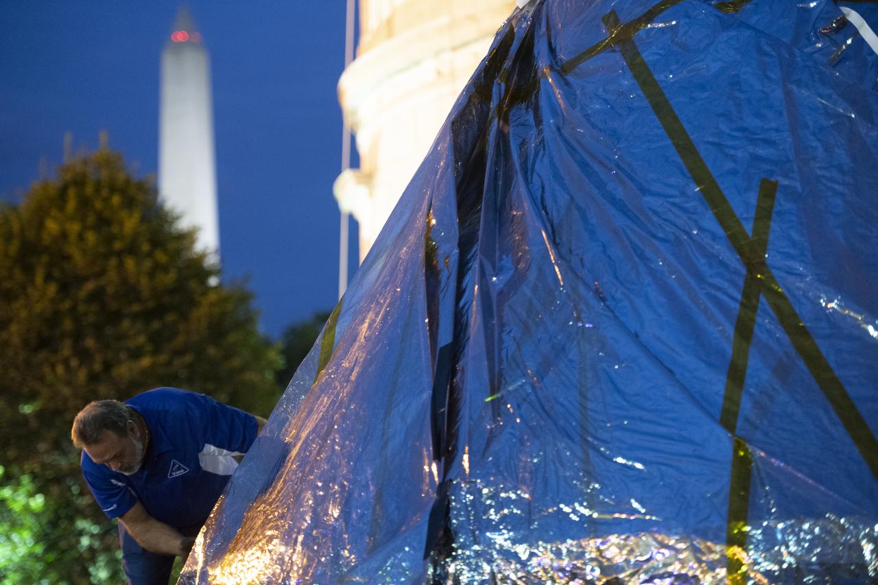 NASA's Orion spacecraft that flew Exploration Flight Test-1 on Dec. 5, 2014 is seen as it arrives at the White House complex, Saturday, July 21, 2018 in Washington, DC. Lockheed Martin, NASA’s prime contractor for Orion, began manufacturing the Orion crew module in 2011 and delivered it in July 2012 to NASA's Kennedy Space Center where final assembly, integration and testing was completed. More than 1,000 companies across the country manufactured or contributed elements to the spacecraft. Photo Credit: (NASA/Joel Kowsky)