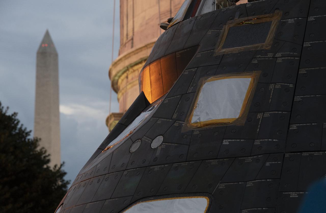 NASA's Orion spacecraft that flew Exploration Flight Test-1 on Dec. 5, 2014 is seen after being uncovered in preparation for being moved onto the White House complex, Saturday, July 21, 2018 in Washington, DC. Lockheed Martin, NASA’s prime contractor for Orion, began manufacturing the Orion crew module in 2011 and delivered it in July 2012 to NASA's Kennedy Space Center where final assembly, integration and testing was completed. More than 1,000 companies across the country manufactured or contributed elements to the spacecraft. Photo Credit: (NASA/Joel Kowsky)